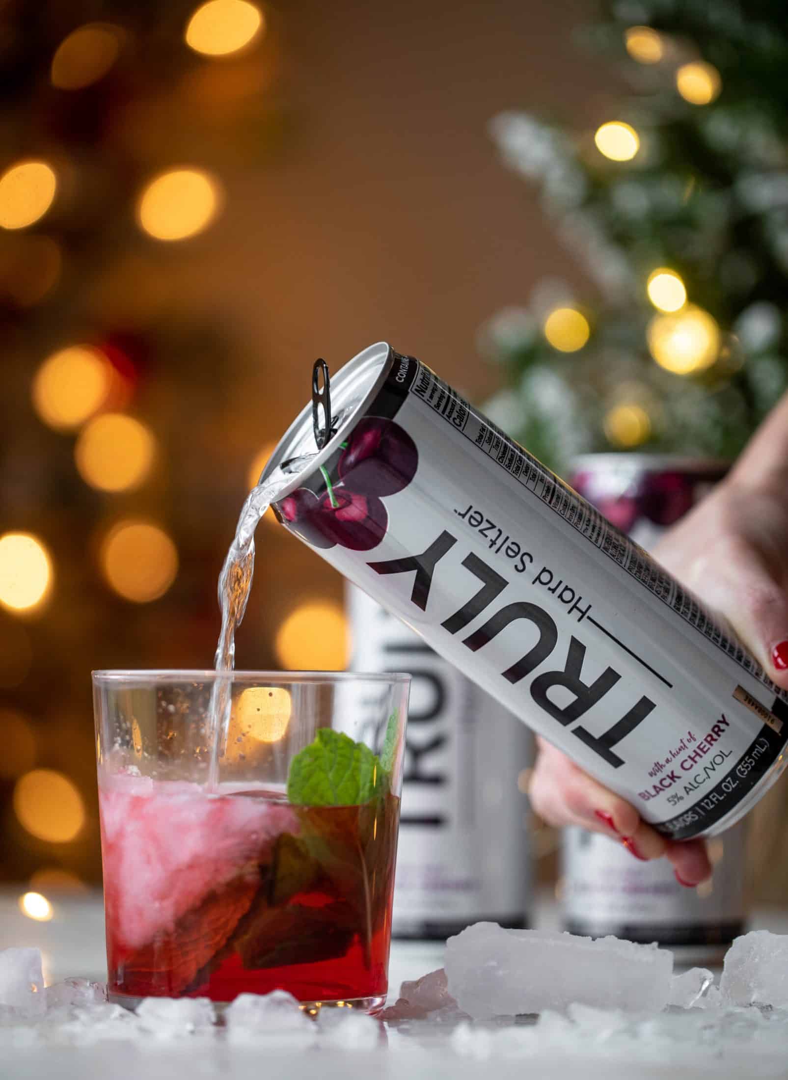 The merry cherry christmas cocktail is here! Vodka and cherries and mint, oh my! This is such a fun drink that can be made into a punch. It's delicious!