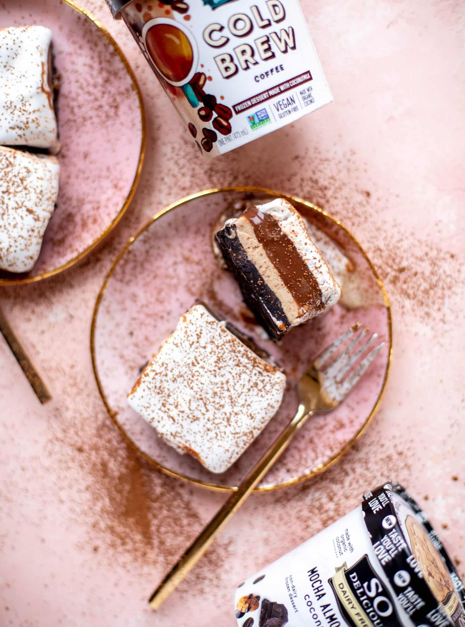 This frozen chocolate cookie dessert is a twist on the classic 90s recipe! Cookie crust, ice cream, homemade hot fudge and whipped cream. It's amazing!