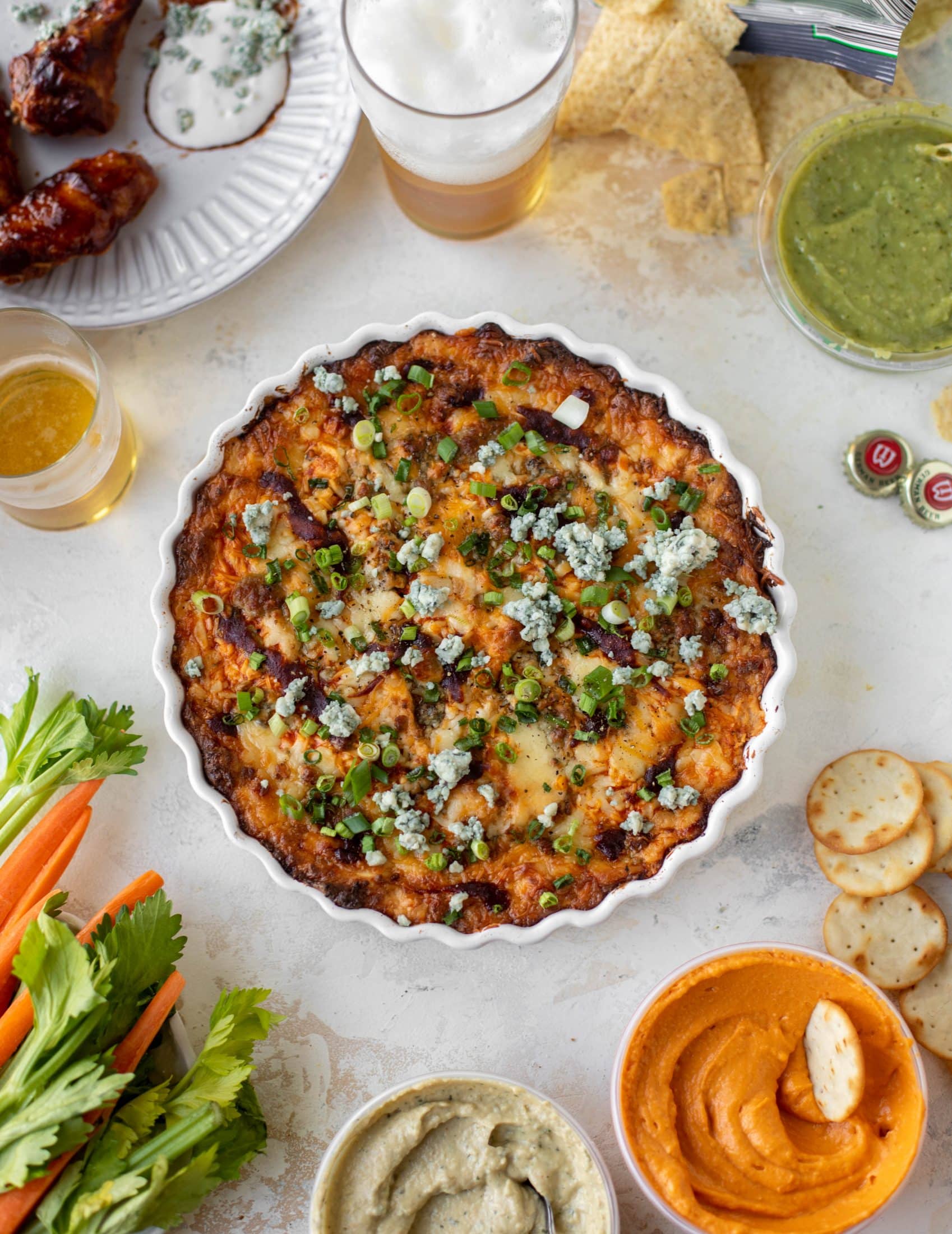 This loaded wing dip is full of buffalo wing sauce, BBQ sauce, honey mustard, ranch, blue cheese and tons of cheddar. All the flavors!