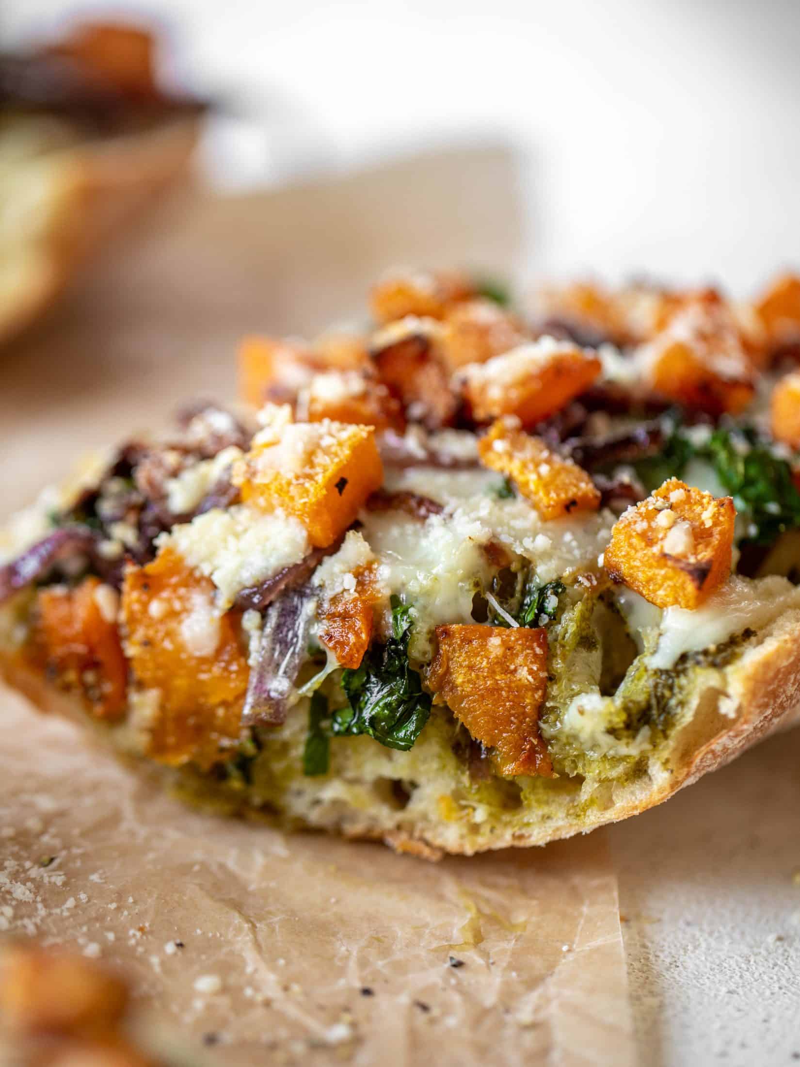 These butternut squash french breads have so much flavor. Pesto, caramelized onions, kale, roasted butternut and tons of fontina cheese. Delicious! 