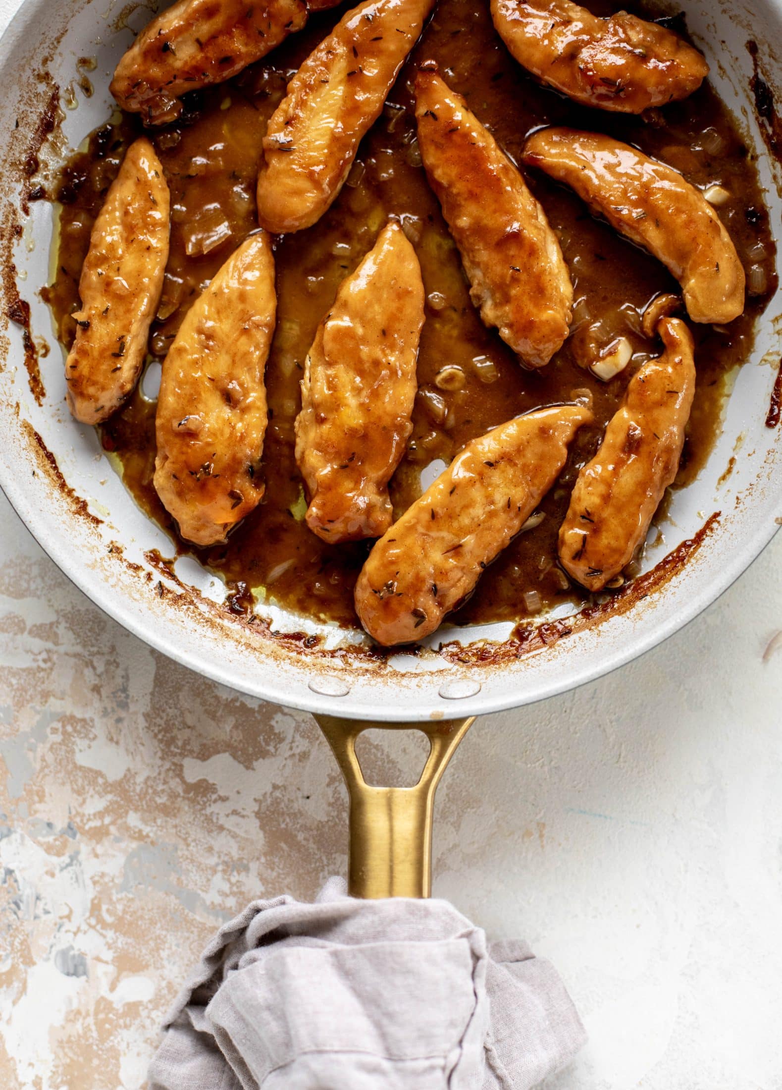 My mom's chicken marsala is easy and ridiculously flavorful! It's made without mushrooms and served alongside almond brown butter green beans.