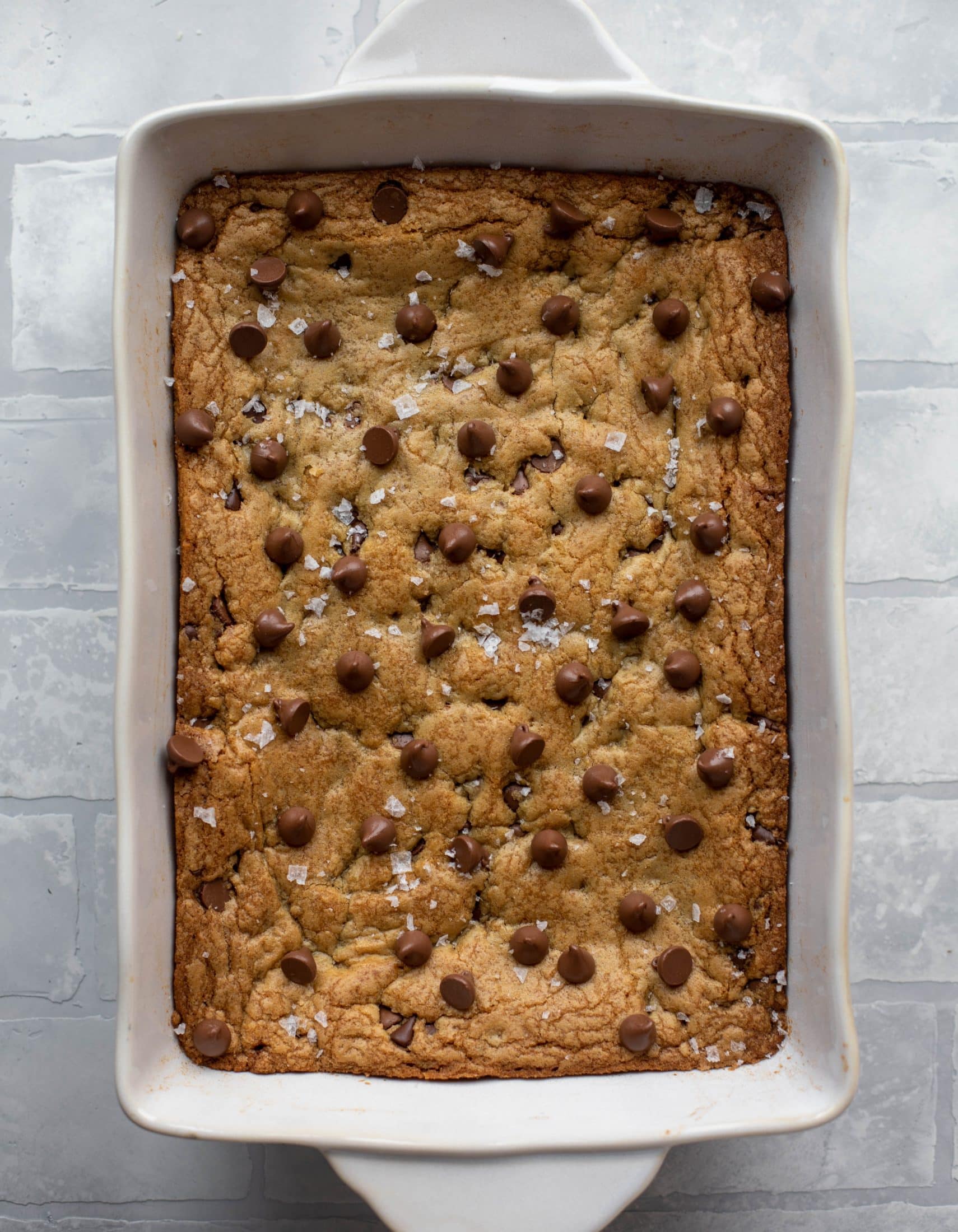 These brown butter chocolate chip cookie bars are chewy, chocolately and sprinkled with flaky salt. What else do you need in life?!