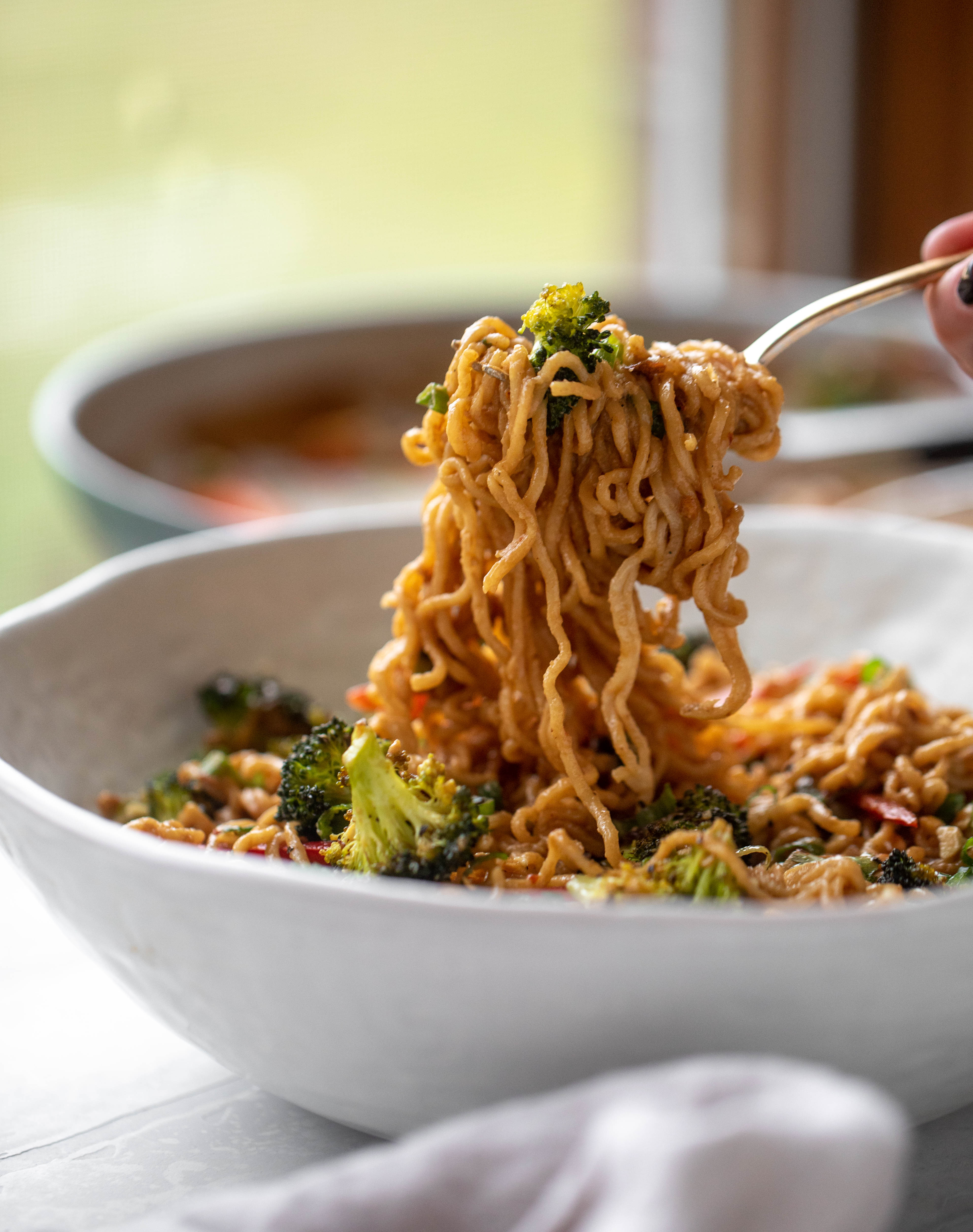 These are the most delicious peanut noodles! Tossed with roasted broccoli, red peppers, scallions, peanuts and an incredibly flavorful sauce!