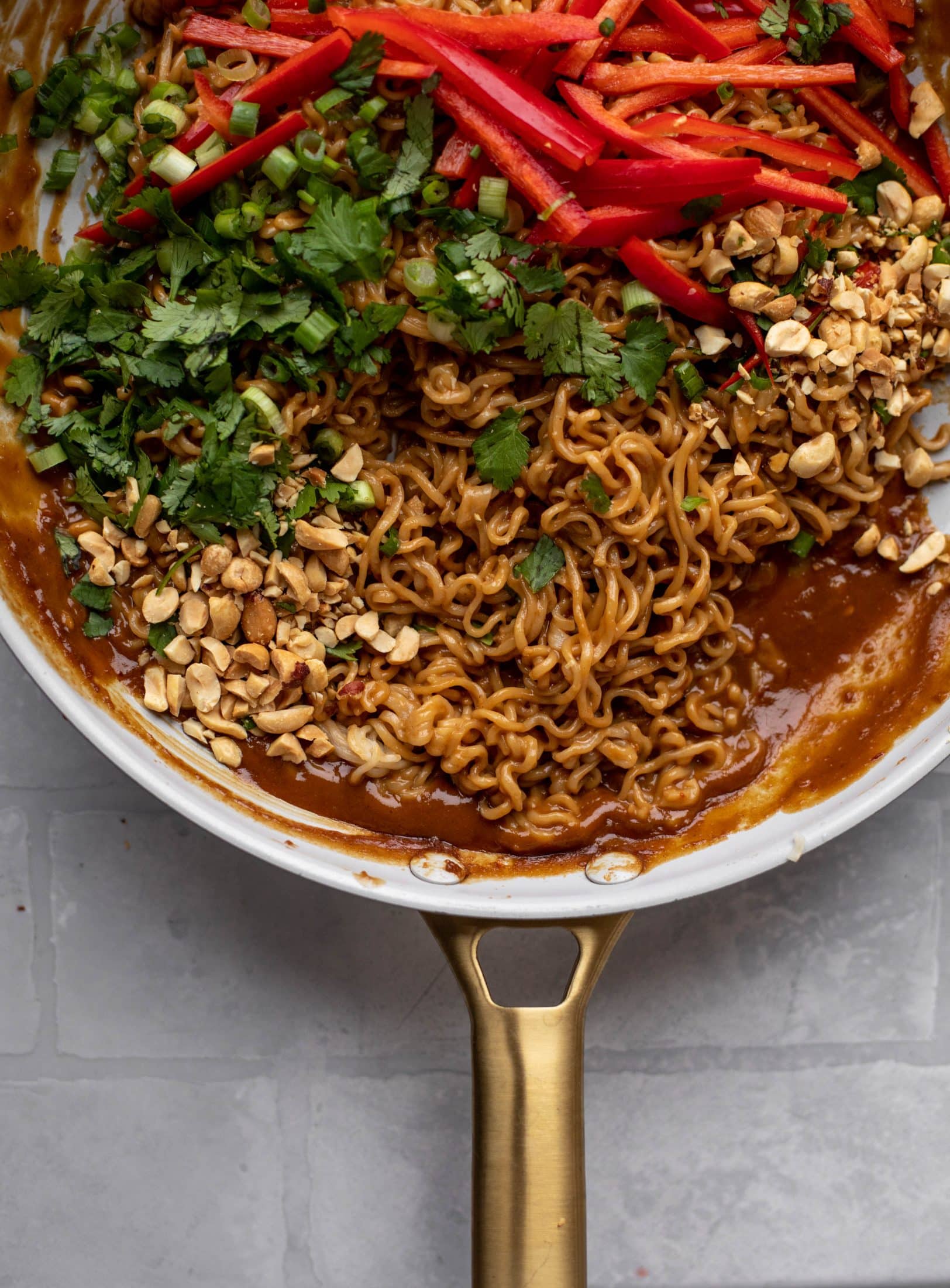 These are the most delicious peanut noodles! Tossed with roasted broccoli, red peppers, scallions, peanuts and an incredibly flavorful sauce!
