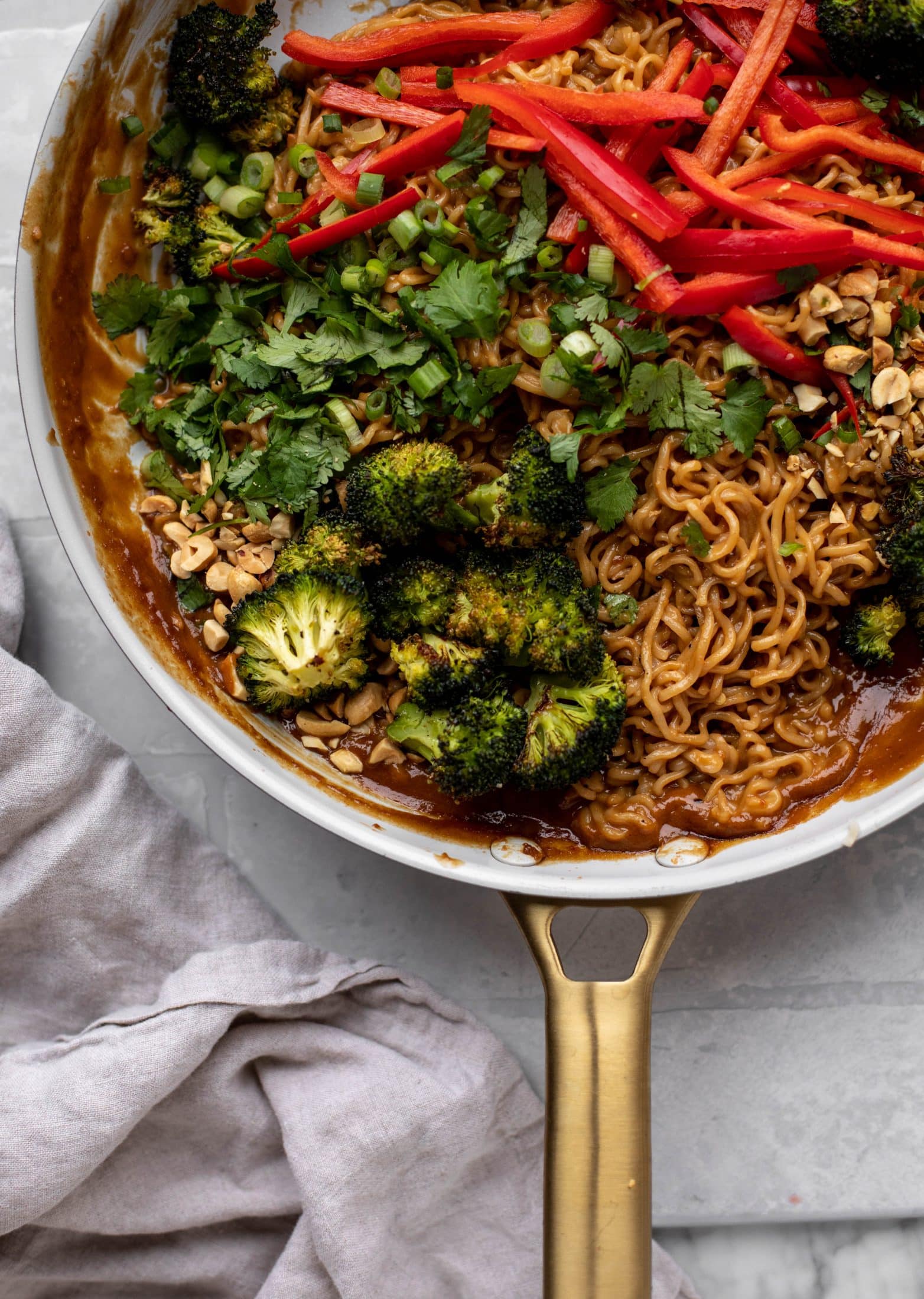 These are the most delicious peanut noodles! Tossed with roasted broccoli, red peppers, scallions, peanuts and an incredibly flavorful sauce!