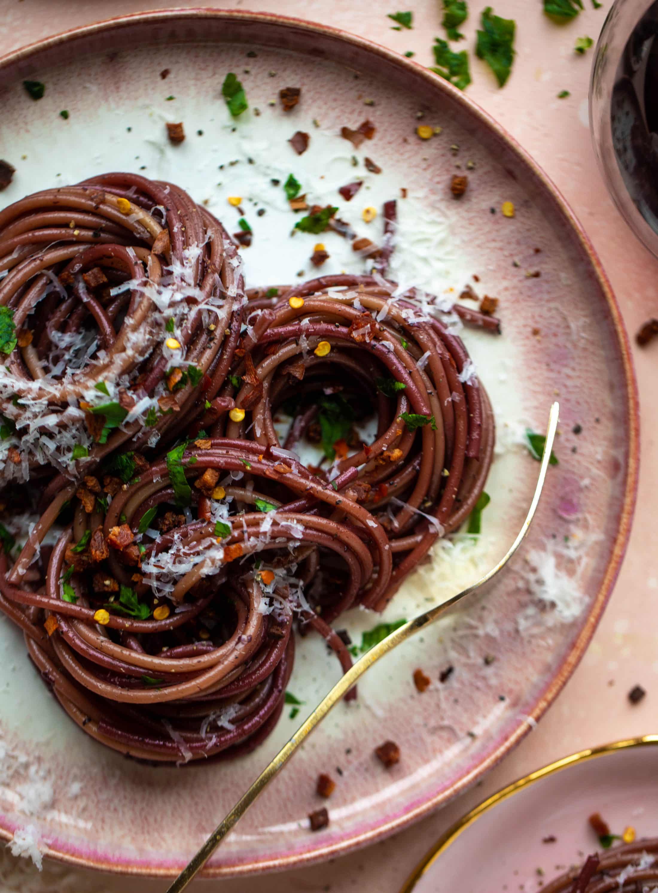 This red wine pasta is an easy, flavorful dinner! Red wine cooked down with garlic and butter until sauce-like. Throw in noodles and you have dinner!