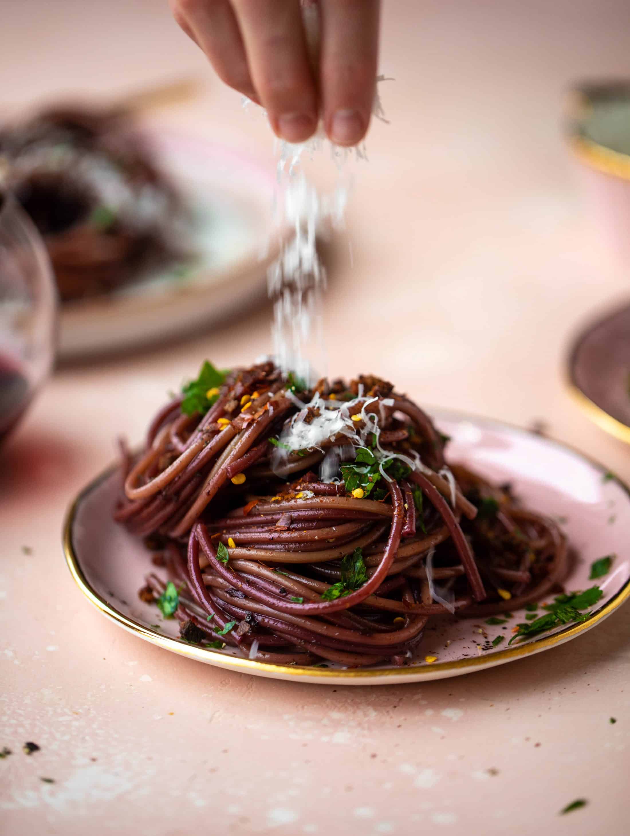 This red wine pasta is an easy, flavorful dinner! Red wine cooked down with garlic and butter until sauce-like. Throw in noodles and you have dinner!
