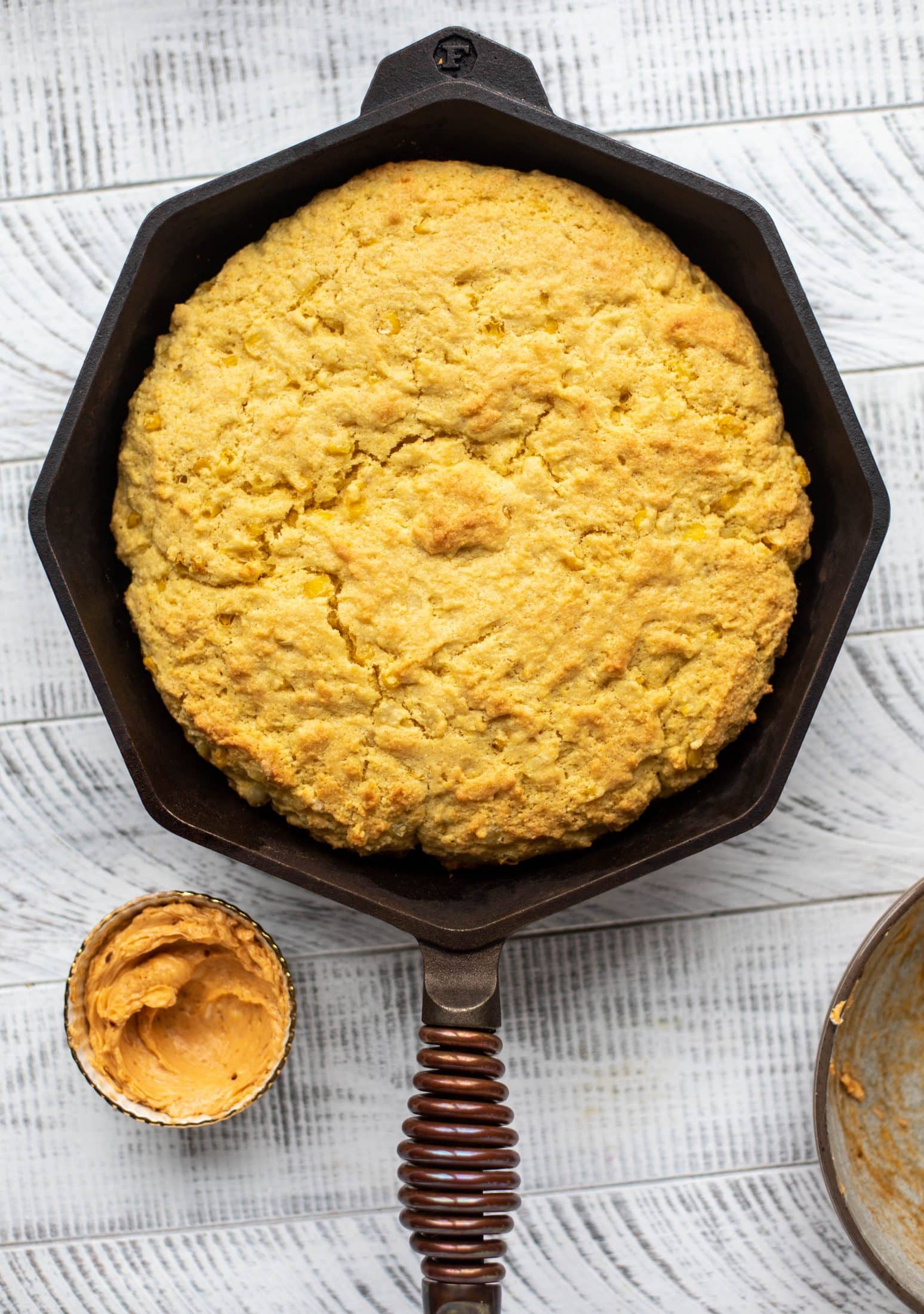 This skillet cornbread is so fluffy and delicious! Serve it hot from the oven with chipotle honey butter. It makes a great appetizer or side dish. 