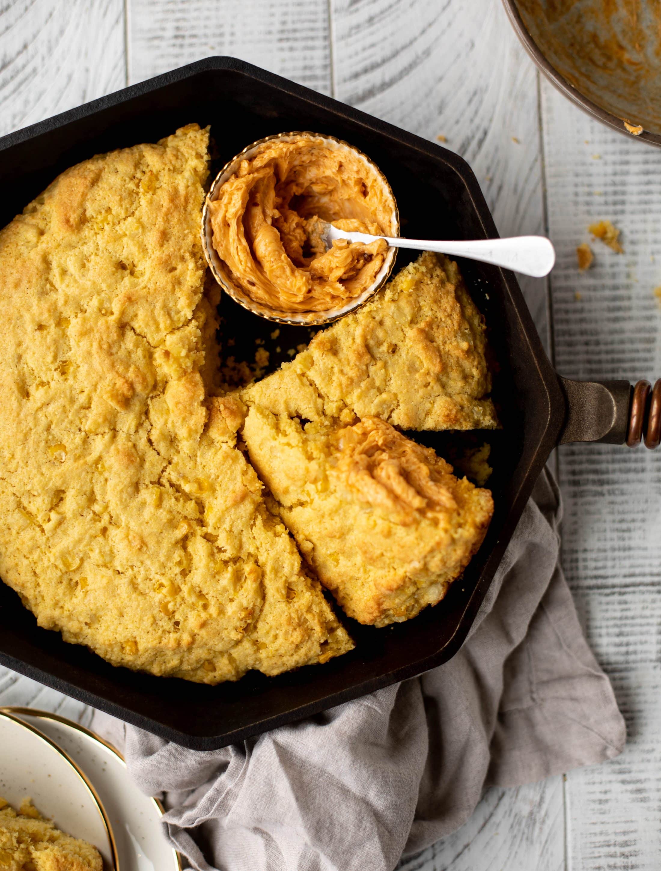 This skillet cornbread is so fluffy and delicious! Serve it hot from the oven with chipotle honey butter. It makes a great appetizer or side dish. 