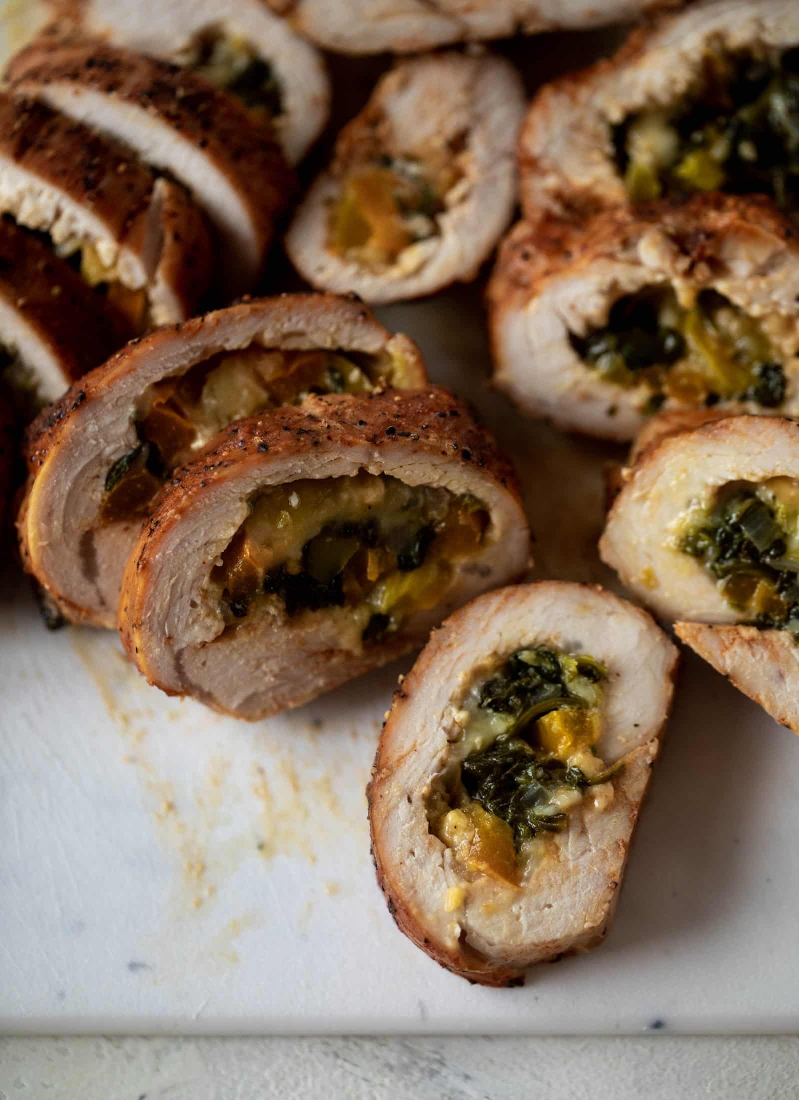 These southwest stuffed turkey tenderloins are so flavorful and filled with spinach, peppers, onions and cheddar! Serve alongside a lime black bean salad.