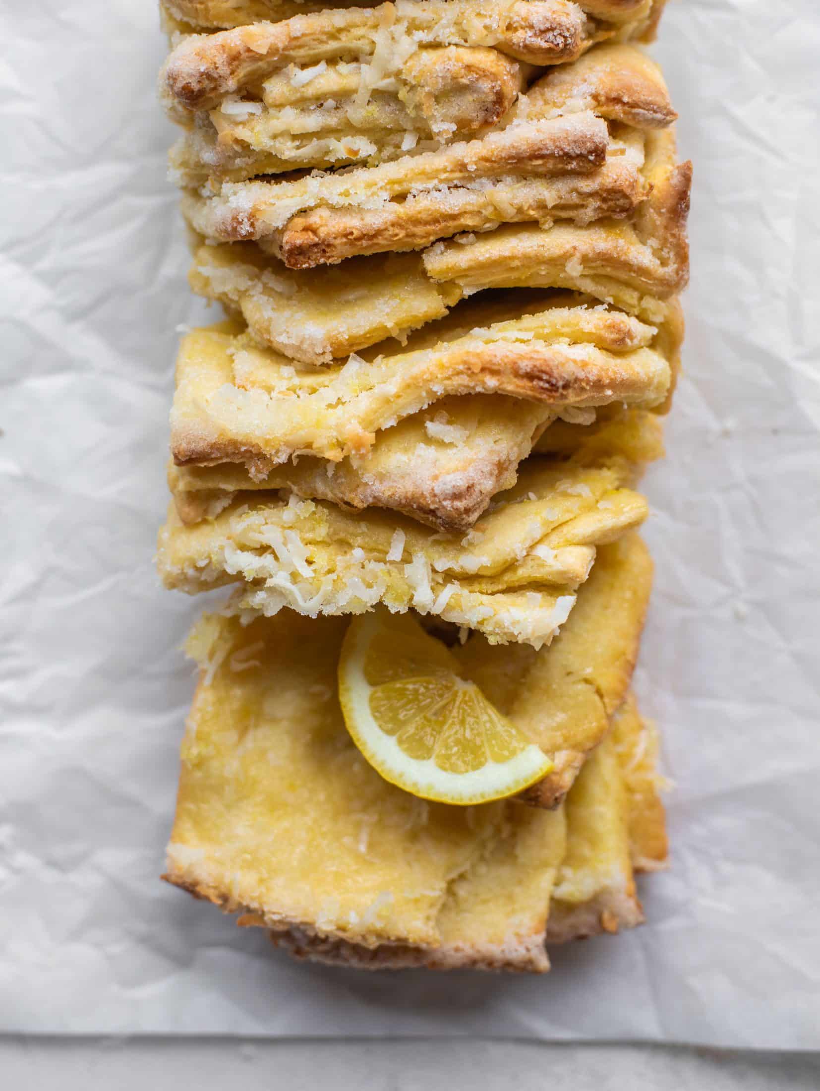 This lemon coconut bread is a pull apart dream! It's perfect for brunch or dessert with the perfect amount of fluffiness. 