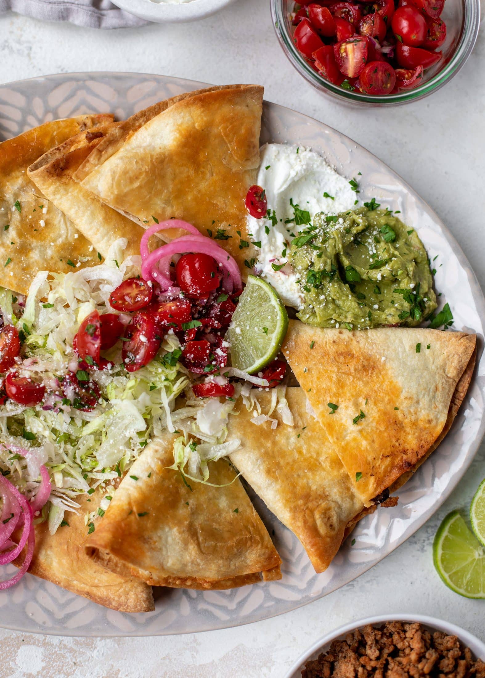 These crispy baked quesadillas will change your life! Make a big batch at once using pantry ingredients and your favorite cheese. 