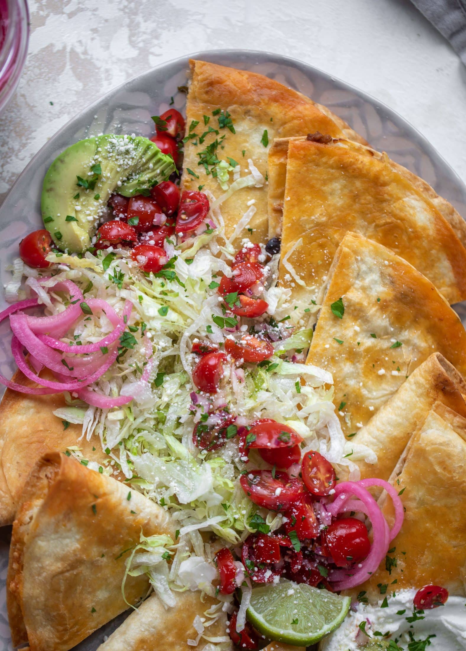 These crispy baked quesadillas will change your life! Make a big batch at once using pantry ingredients and your favorite cheese. 