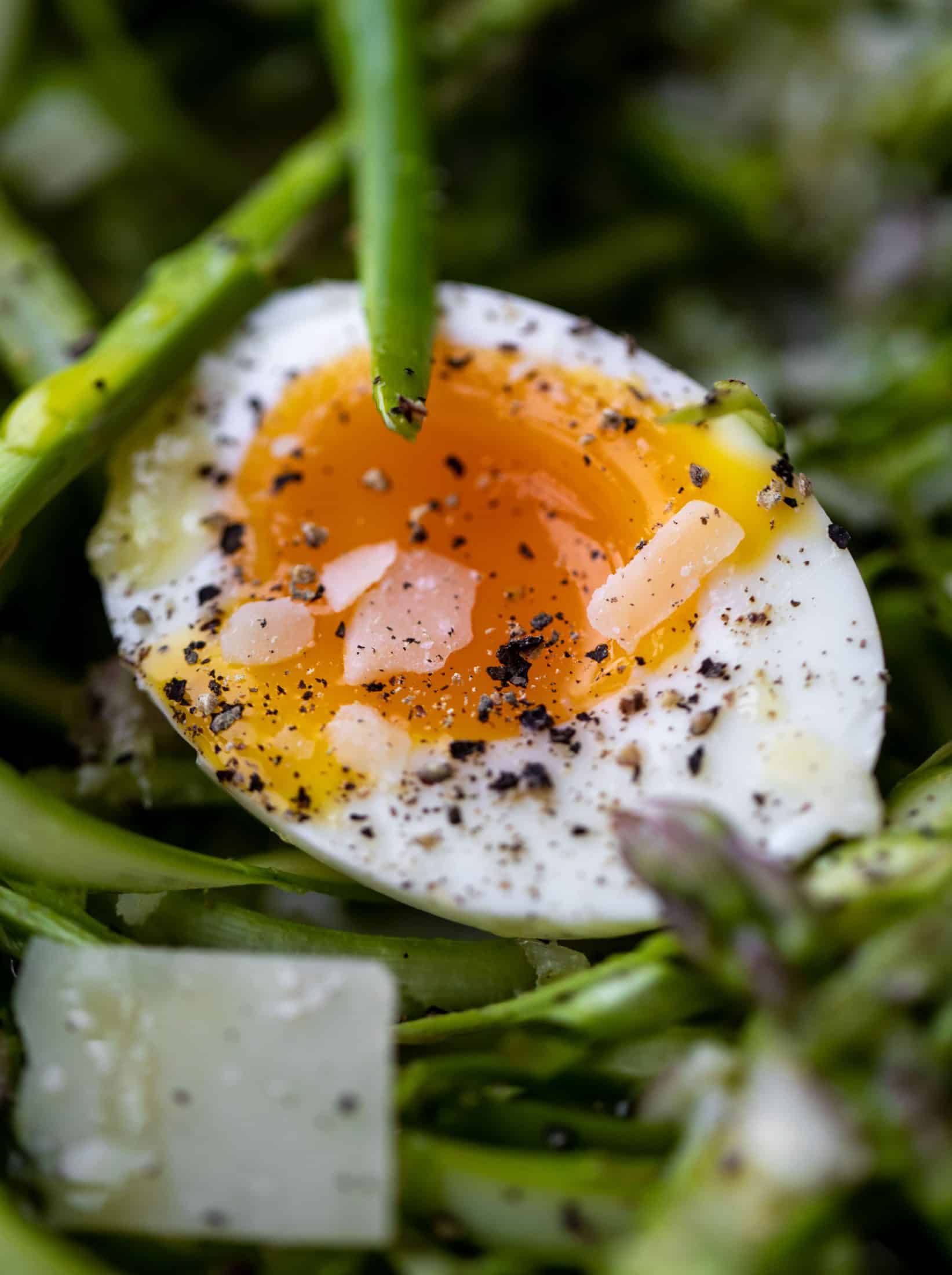 This shaved asparagus salad is tossed with a delicious parmesan vinaigrette, then topped with soft boiled eggs and finished with crunchy garlic breadcrumbs!