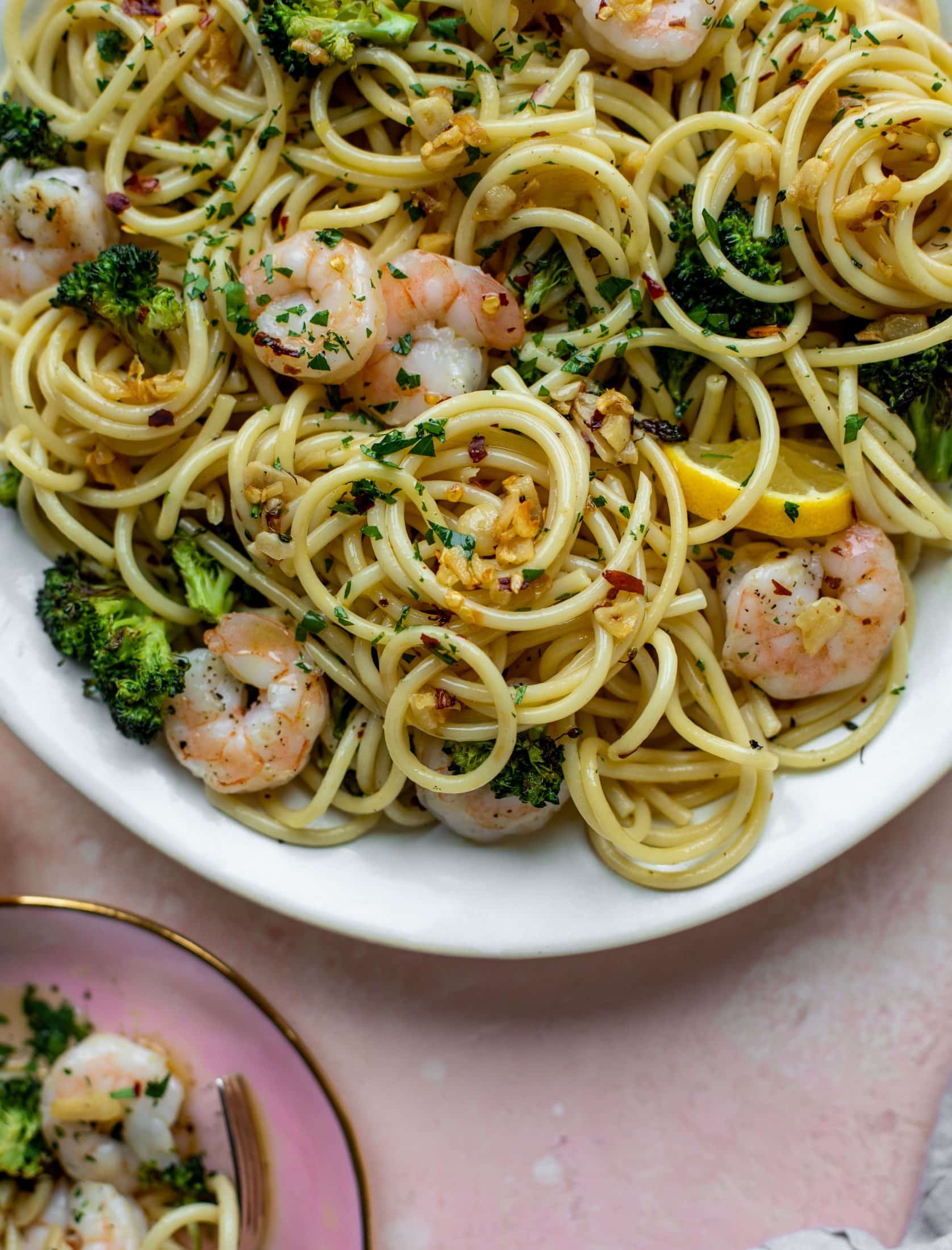 This garlic sauce pasta is incredible! Roasted shrimp and broccoli twirled with garlic oil noodles and crushed red pepper. Divine!