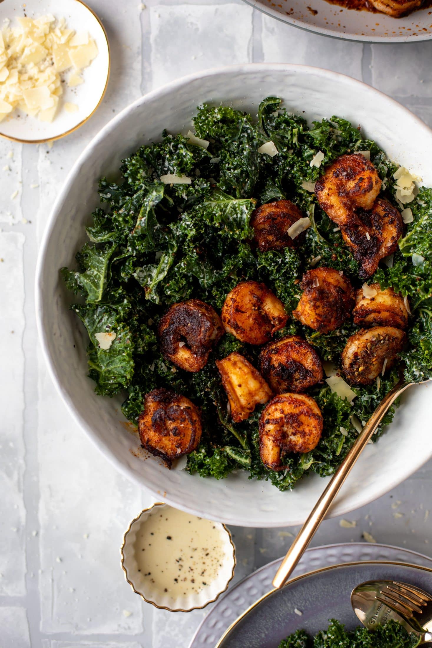 This blackened shrimp kale caesar is loaded with flavor. Spiced, buttery shrimp pan fried until golden, then thrown on kale caesar salad. Delish!