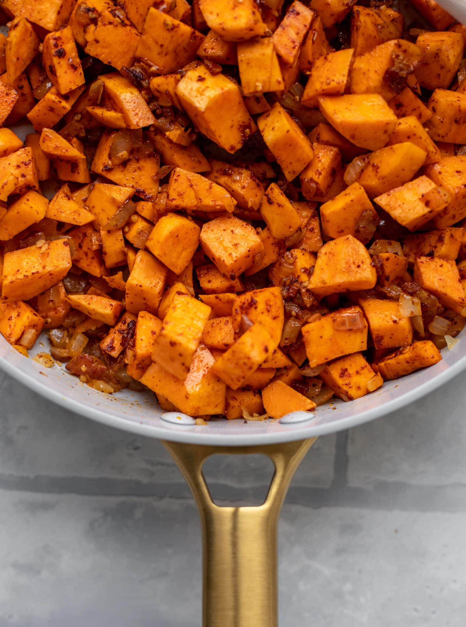 This chipotle sweet potato hash is perfect for breakfast, lunch or dinner. Bulked up with quinoa and tons of flavor, it's a great pantry weeknight meal!