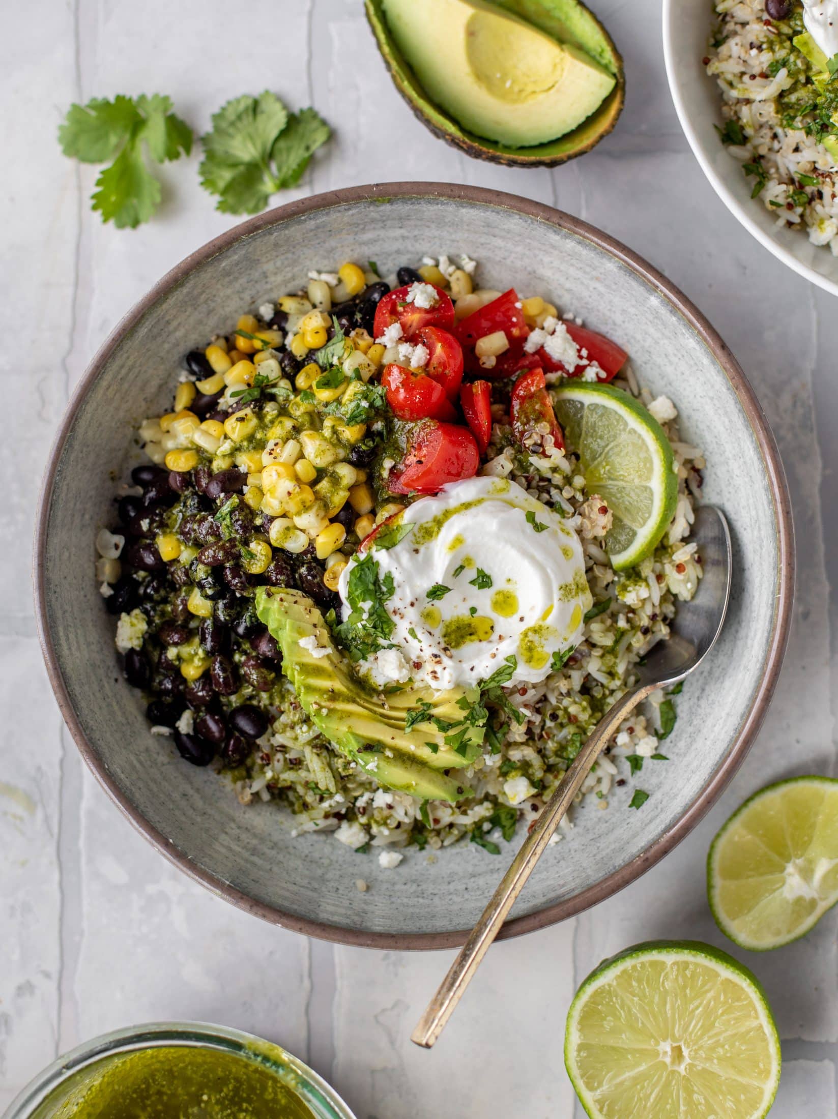 These baja grain bowls are a delicious copycat of the Panera baja grain bowls! Rice, quinoa, beans, tomatoes and cilantro lime vinaigrette!
