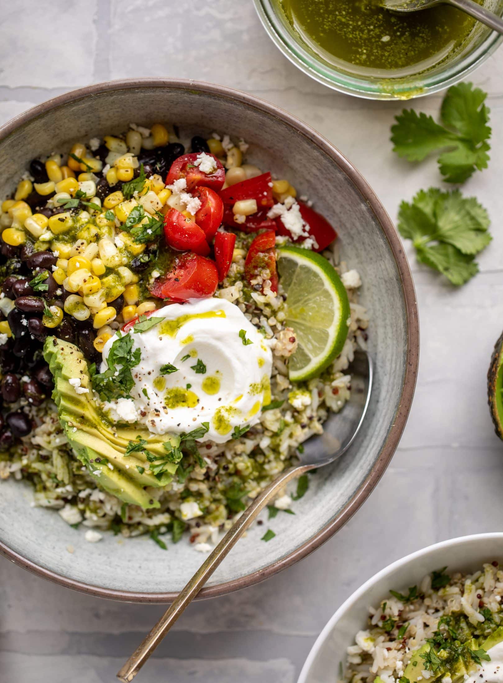 These baja grain bowls are a delicious copycat of the Panera baja grain bowls! Rice, quinoa, beans, tomatoes and cilantro lime vinaigrette!