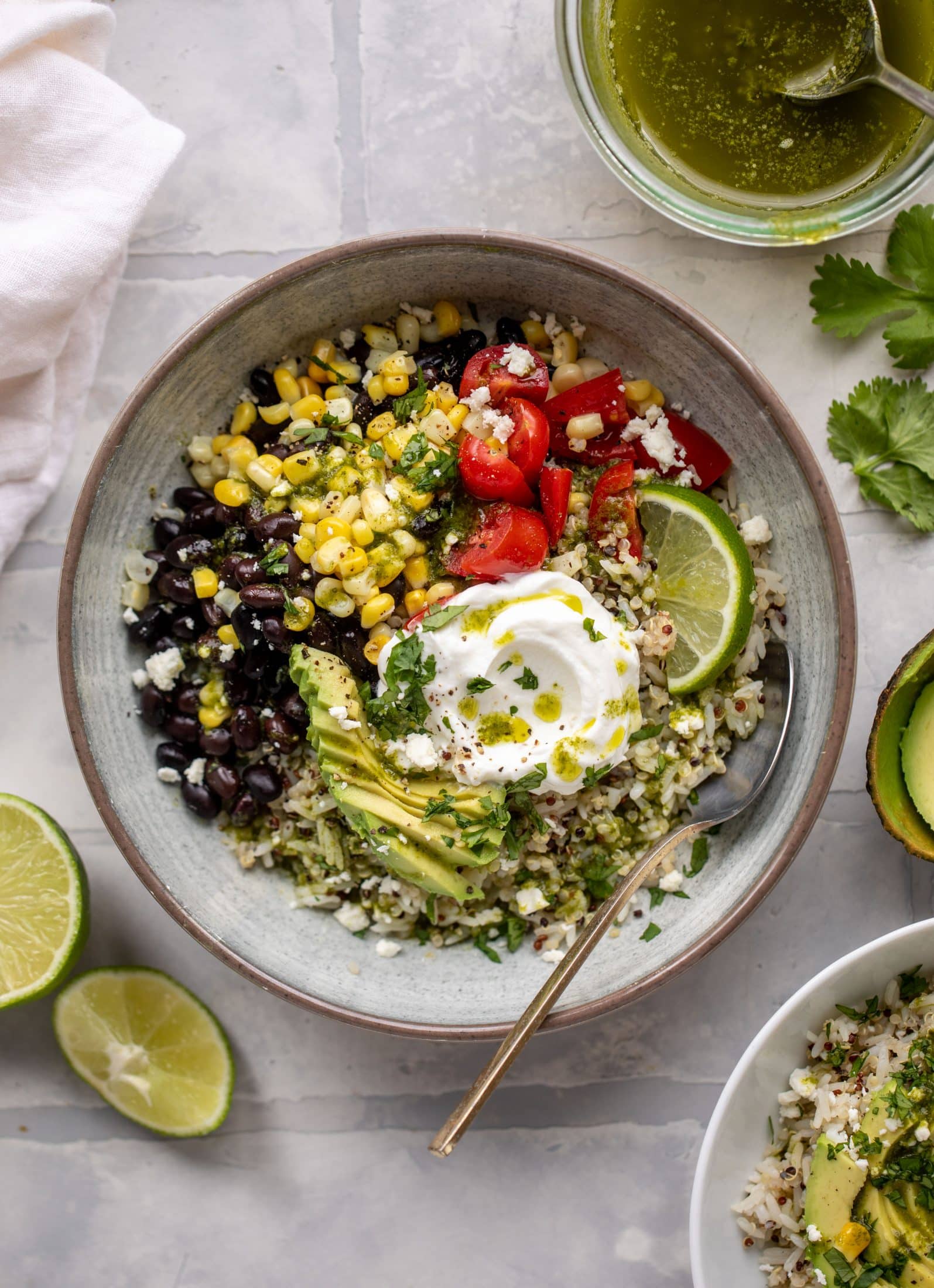 These baja grain bowls are a delicious copycat of the Panera baja grain bowls! Rice, quinoa, beans, tomatoes and cilantro lime vinaigrette!