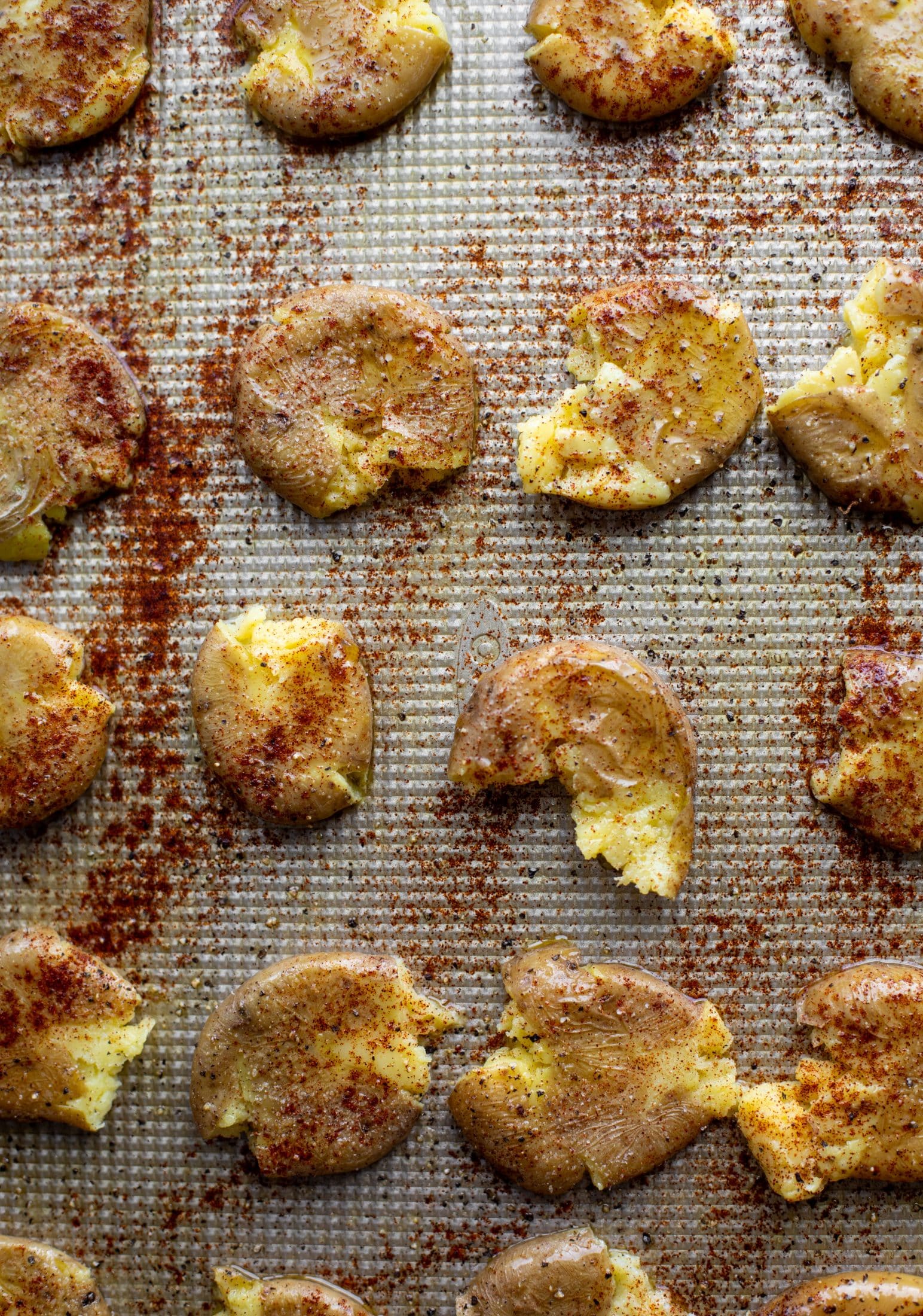 smashed chipotle potatoes on a baking sheet