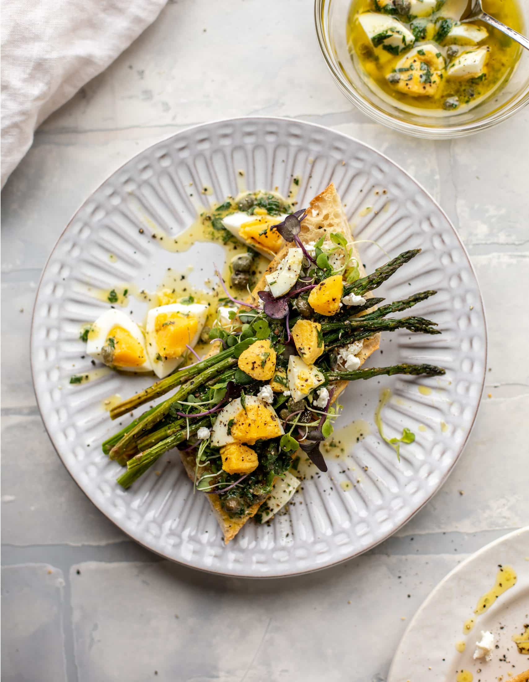 This hard boiled egg vinaigrette is a great way to use up leftover hard boiled eggs! It's fabulous on roasted vegetables, salads and toast.