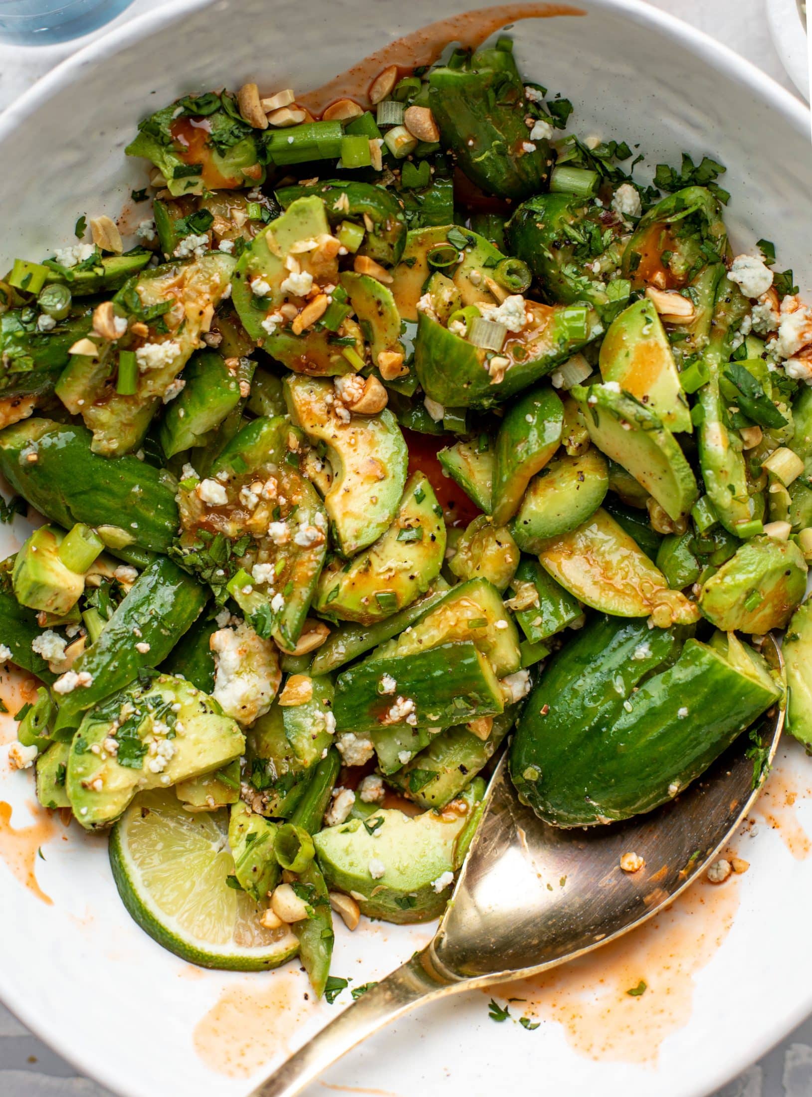 This smashed buffalo cucumber salad is filled with tons of buffalo wing flavor! Avocado, blue cheese, peanuts and lime juice make this irresistible. 