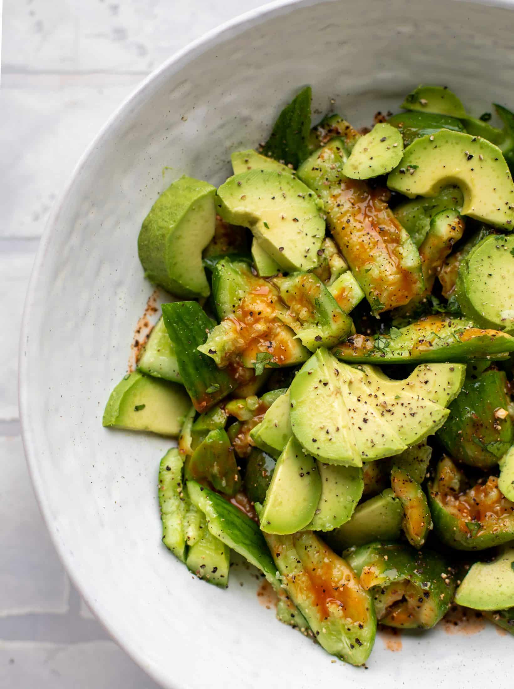 This smashed buffalo cucumber salad is filled with tons of buffalo wing flavor! Avocado, blue cheese, peanuts and lime juice make this irresistible. 