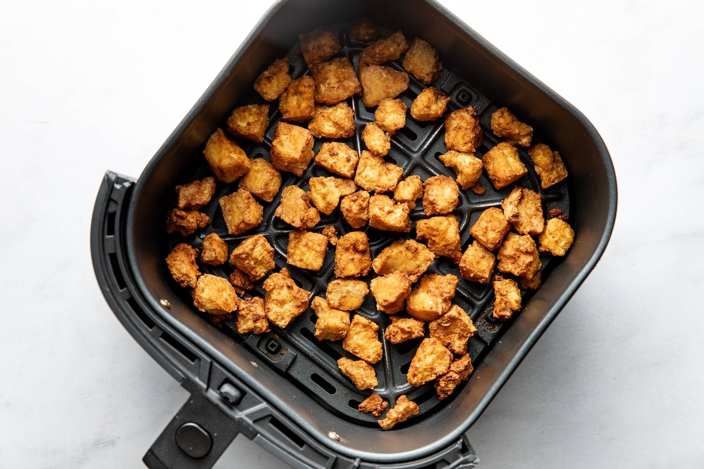 Crispy tofu in an air fryer.