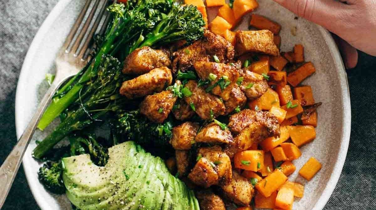 Chicken and sweet potato meal prep bowls with broccoli.
