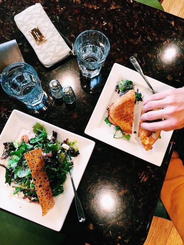 Table with plates of food.