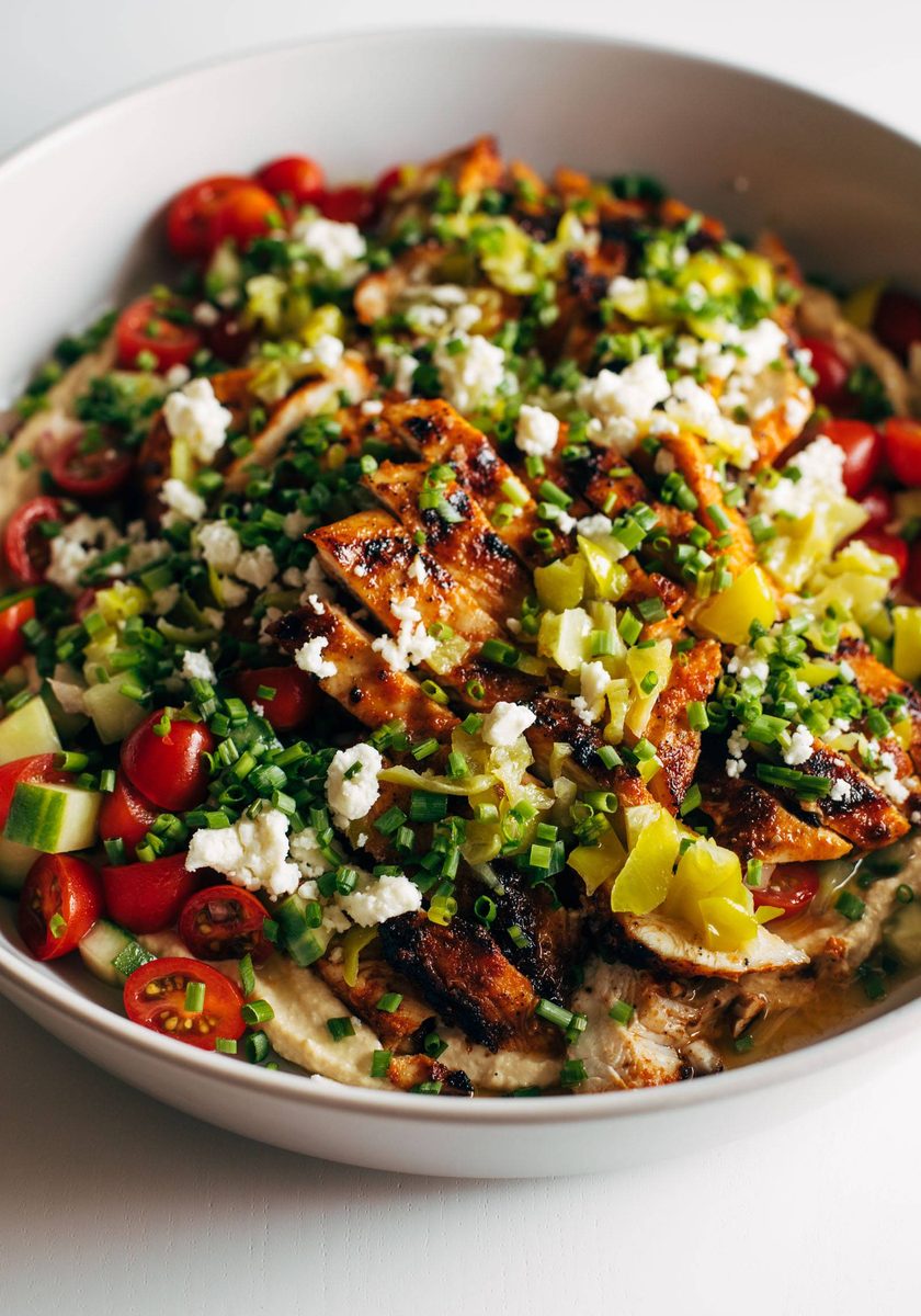 Grilled chicken with pepperoncini garlic butter on a platter