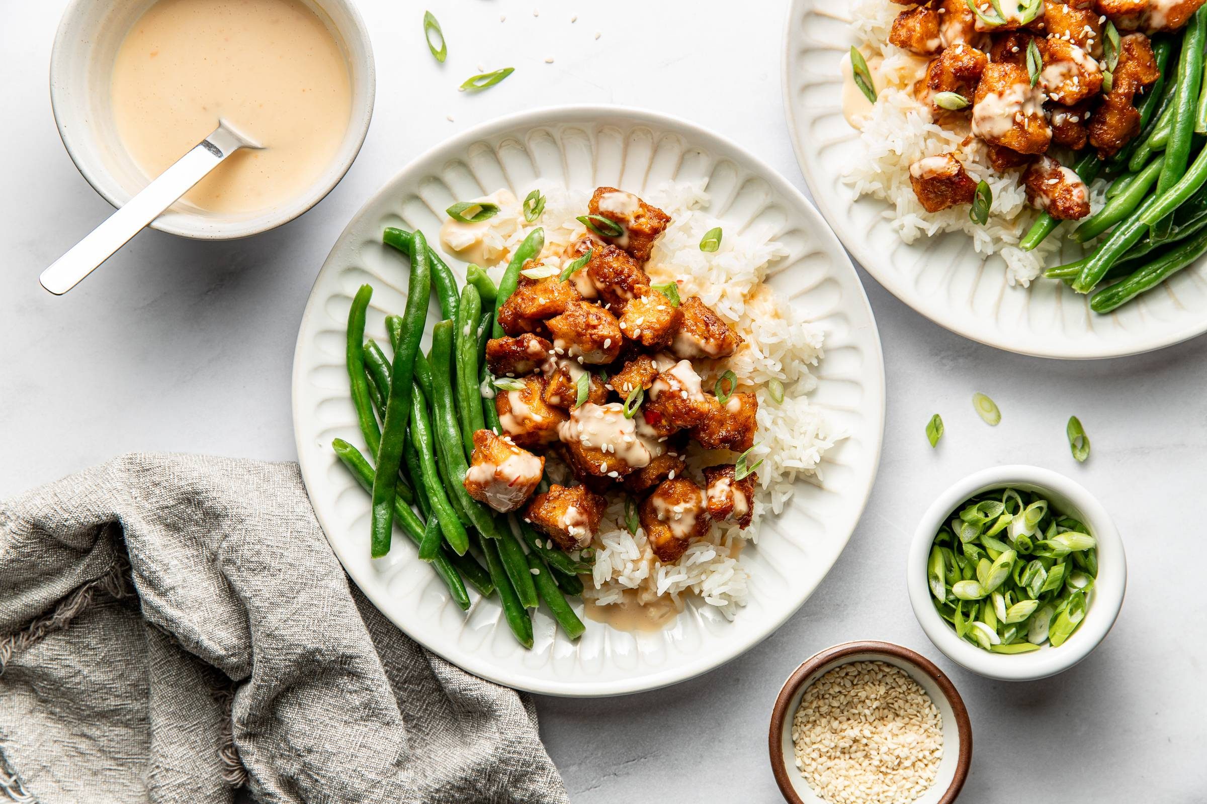 Bang bang tofu with rice and green beans.
