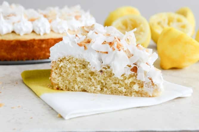 Easy Lemon Cake with Marshmallow Frosting + Toasted Coconut I howsweeteats.com