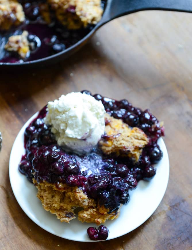 Skillet Blueberry Cobbler with a Cheddar Biscuit Crust I howsweeteats.com