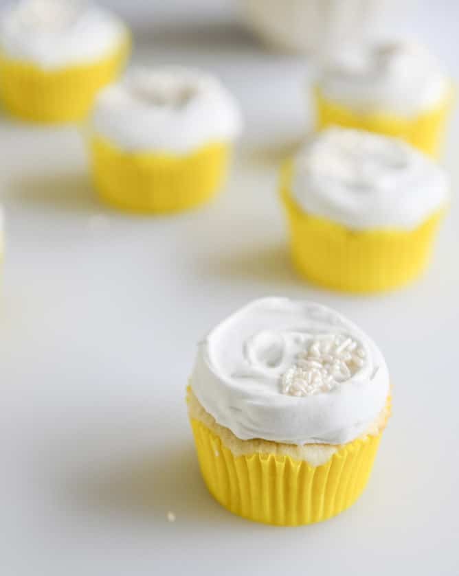 Fluffy Lemon Cupcakes with Whipped Coconut Cream I howsweeteats.com