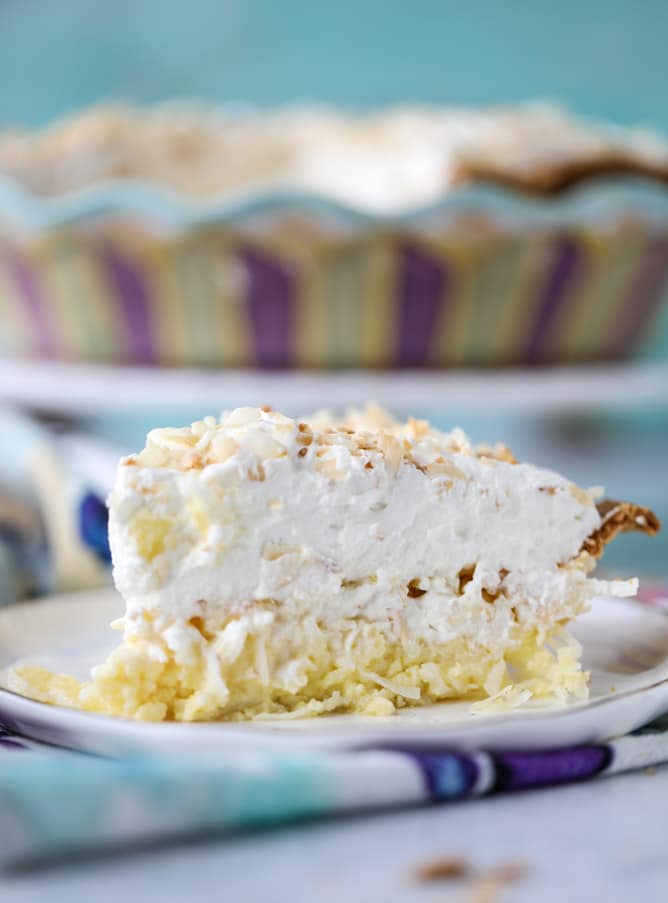 coconut custard pie with coconut whipped cream I howsweeteats.com