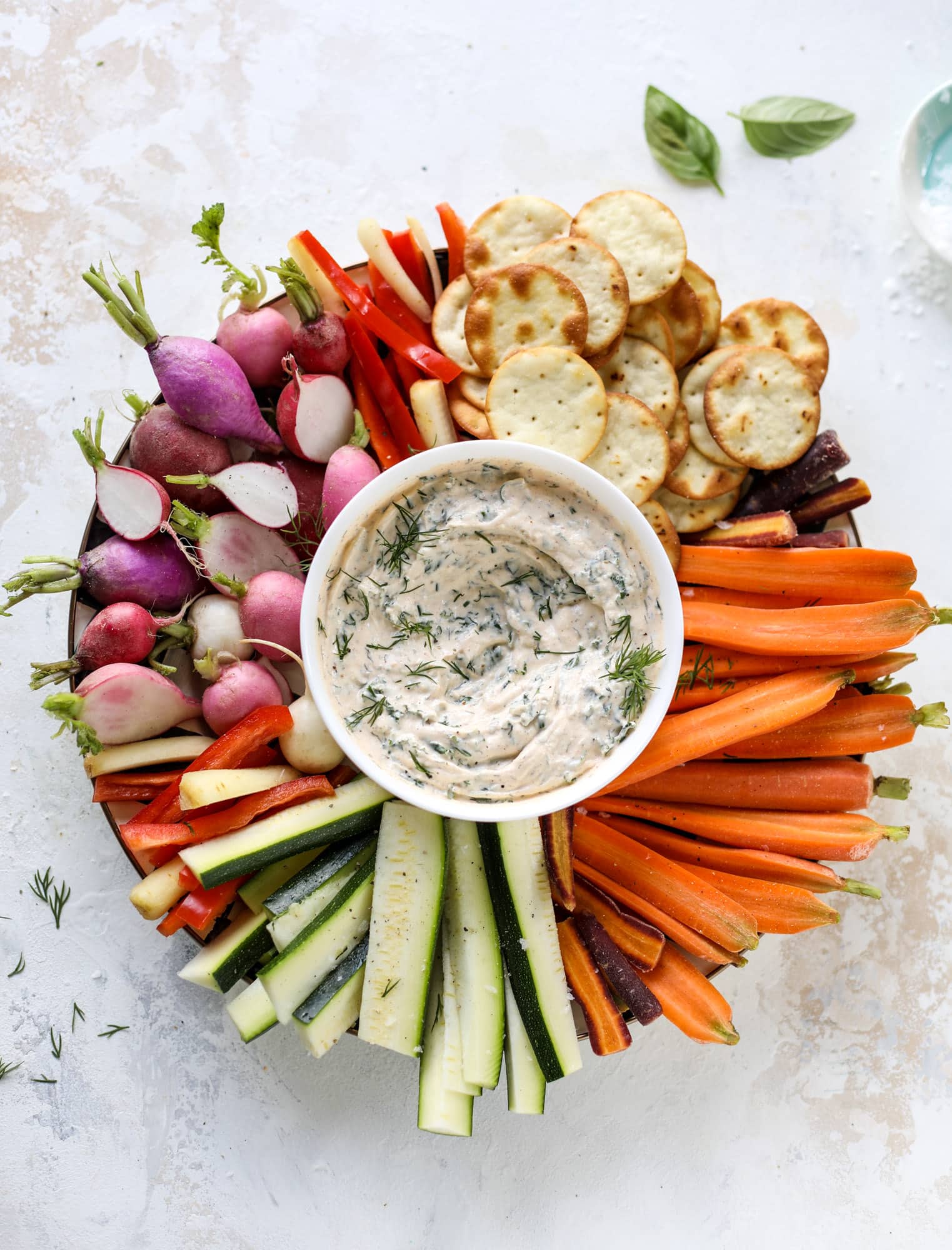This greek yogurt ranch dip is fabulous for a summertime pool tip and it's full of greens! Made with a homemade ranch spice seasoning, lots of shredded greek kale and greek yogurt, it's the perfect dip for crudite or chips! I howsweeteats.com #kale #greek #yogurt #ranch #dip #healthy #snacks