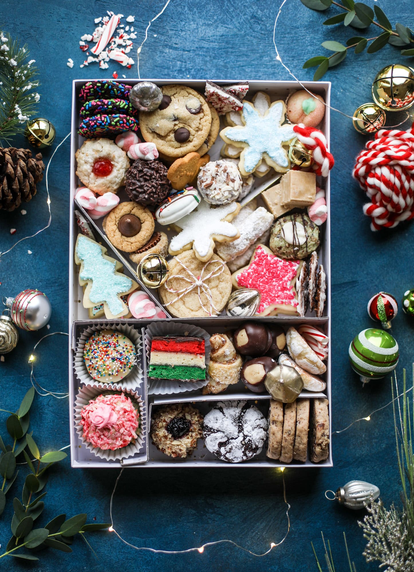 This list is made up of my 2018 best cookies to bake for Christmas and the holiday season! These are tried and true favorites that our friends and family love - ones we put on our cookie trays every single year! I howsweeteats.com #cookies #christmas #box