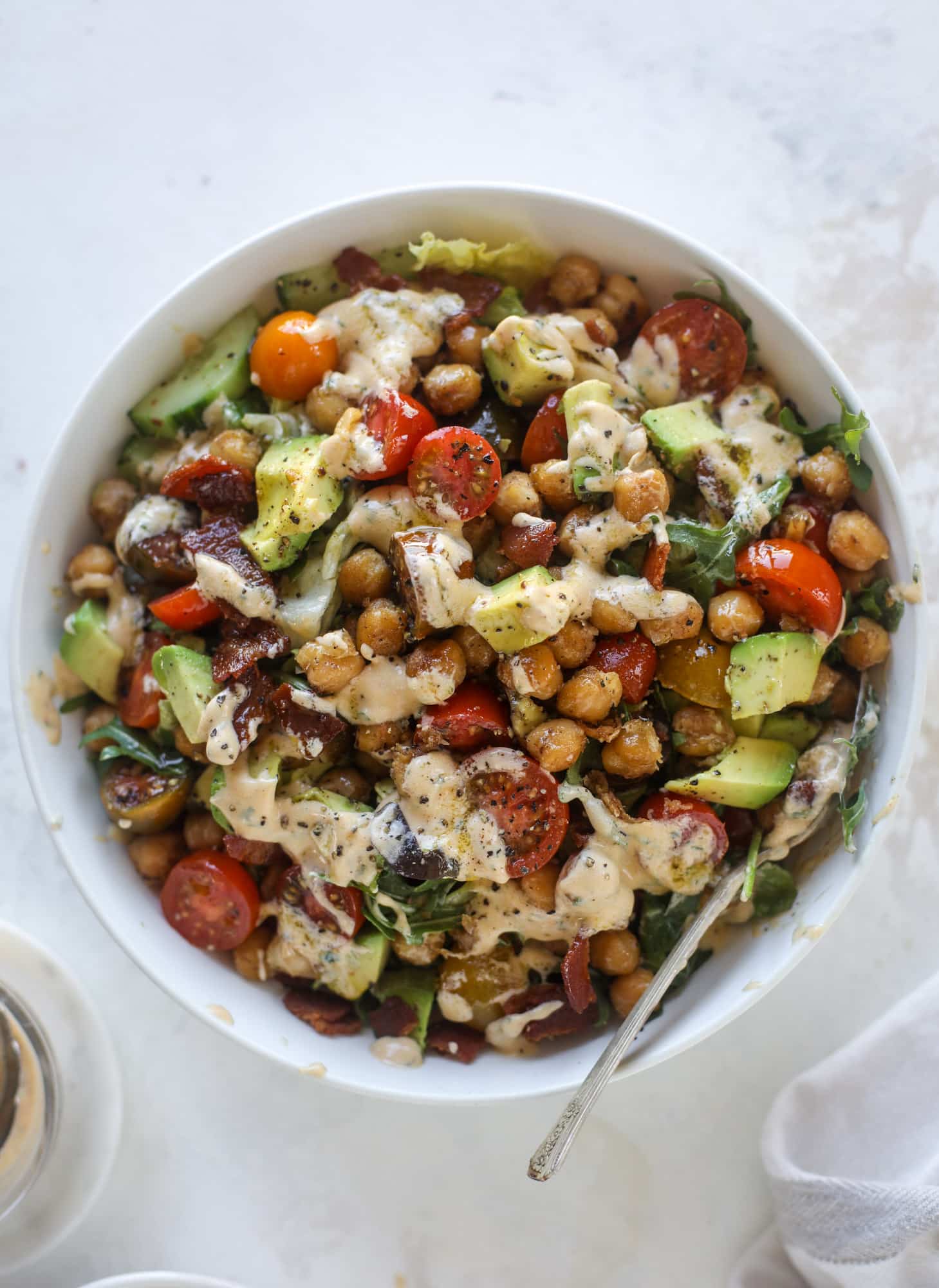 The chickpea bacon ranch salad has a ton of crispy, crunchy texture and flavor. It's satisfying and super easy to prep ahead of time too! I howsweeteats.com #chickpea #salad