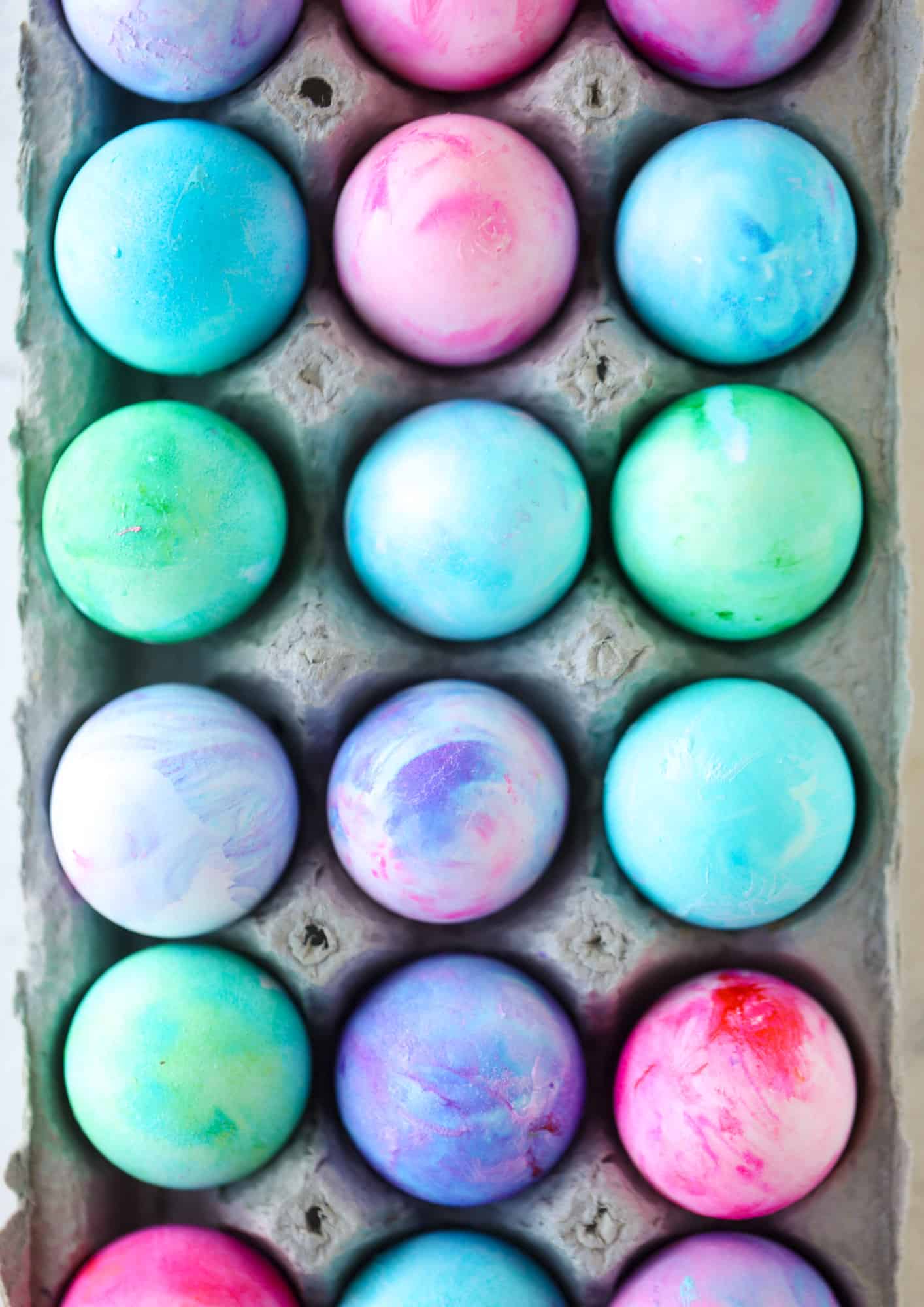 This is how to dye eggs with cool whip! It's so fun, super kid-friendly and ridiculously easy too. I love using this method to make unicorn eggs!