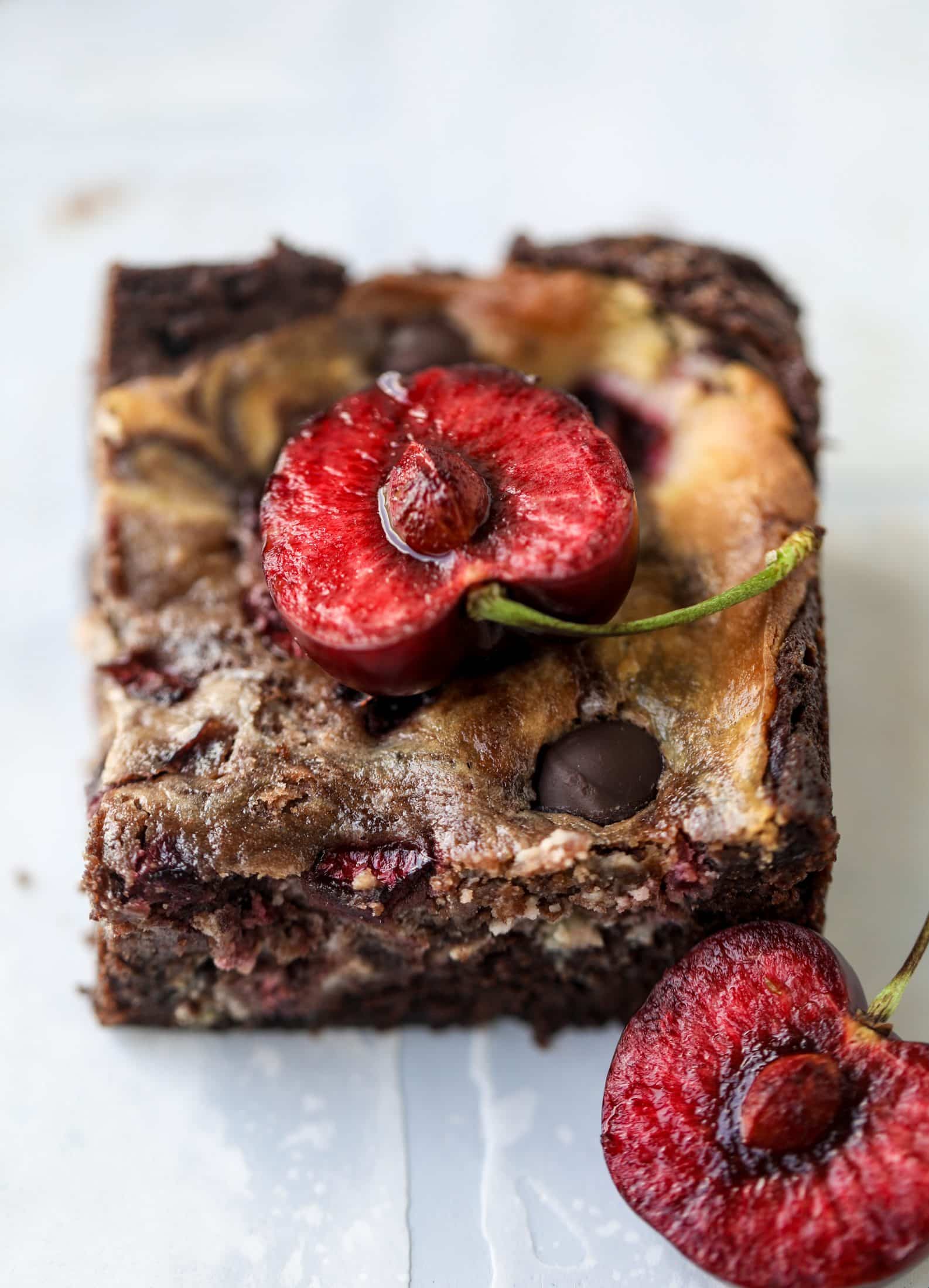 These cherry cheesecake swirl brownies are super rich and fudgy, filled with dark chocolate and fresh cherry, topped with a cherry cheesecake swirl.