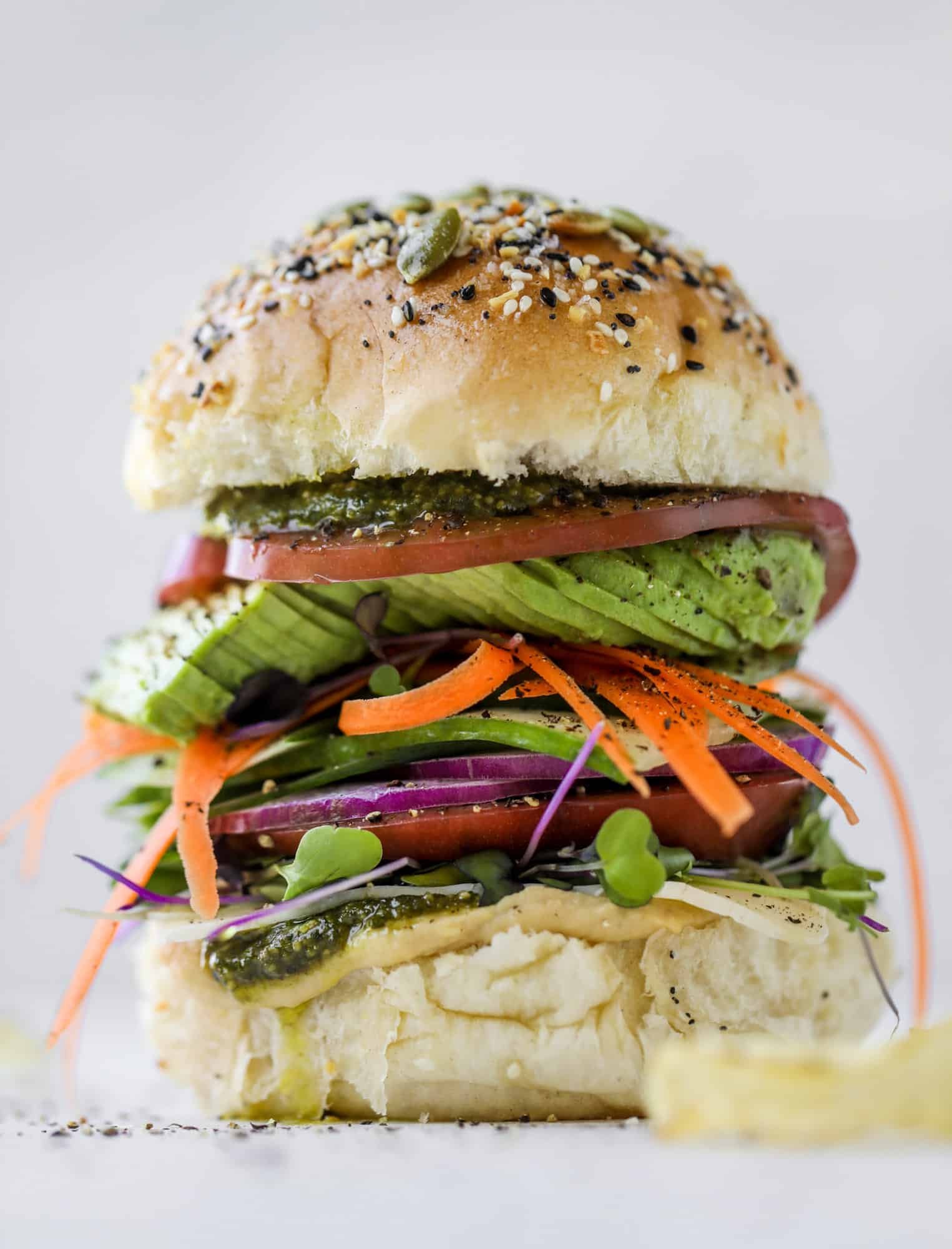This summer veggie sandwich is full of creamy hummus, fresh pesto and havarti cheese along with tons of sliced, fresh vegetables. Best lunch ever!