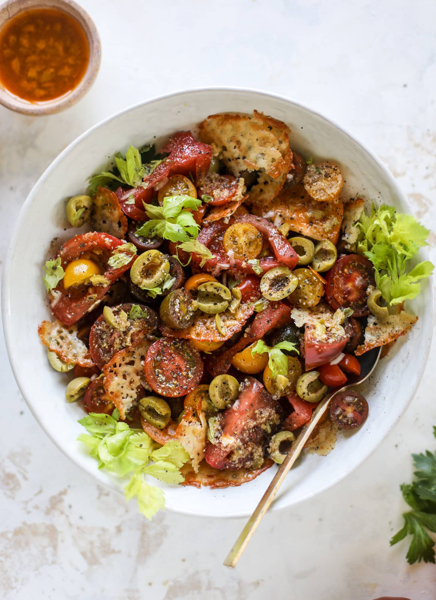 This bloody mary tomato salad has all the incredible flavor of the bloody mary cocktail! Topped with cheddar crisps, it's delicious! 
