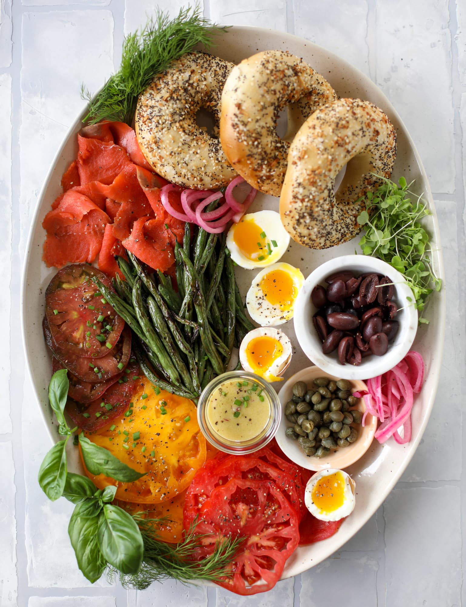 These nicoise bagels are a spin on my favorite salad! Loaded with smoked salmon, blistered green beans and tons of goodness. They are delish!
