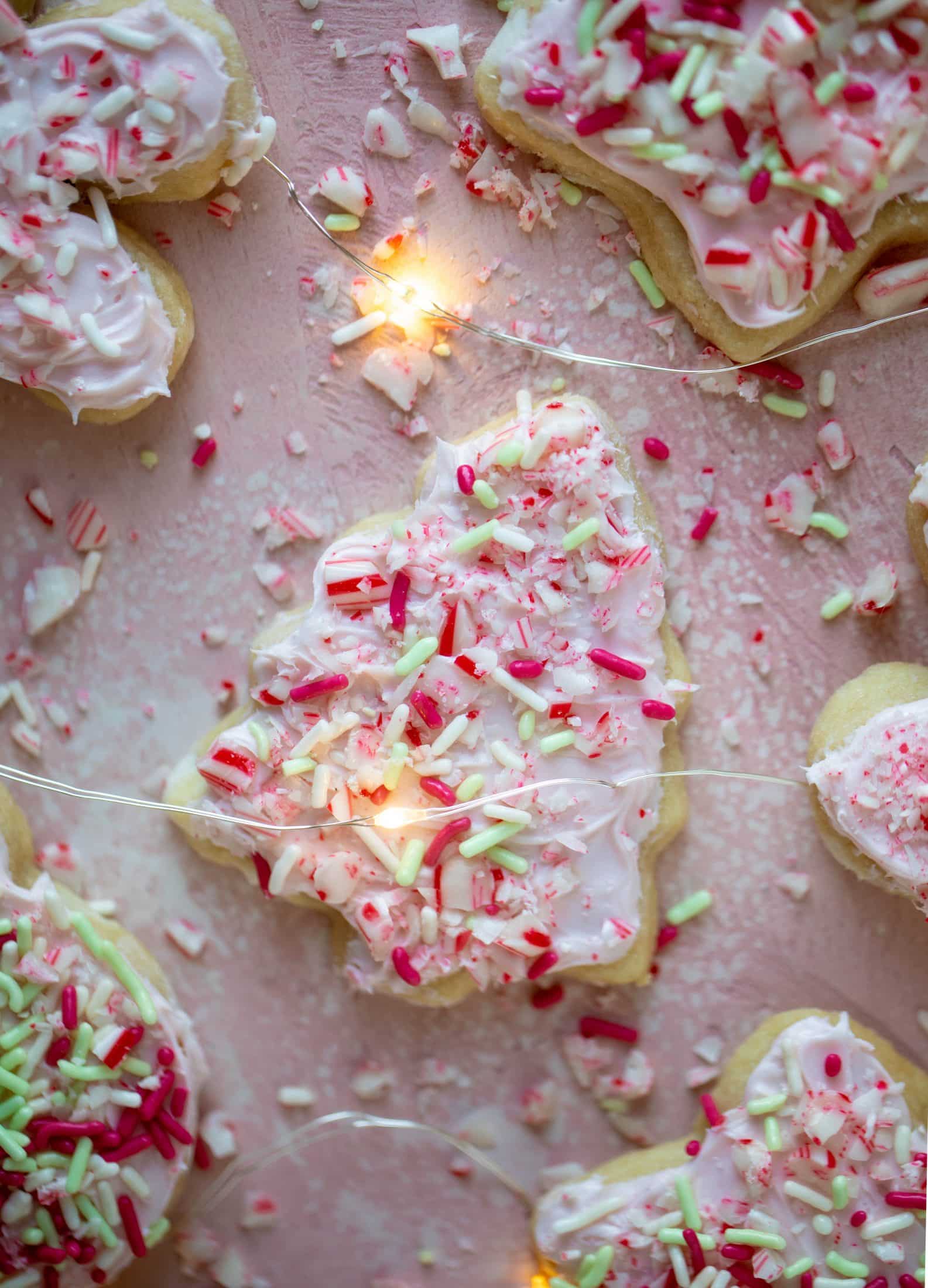 Pink peppermint sugar cookies are classic vanilla cut out cookies topped with peppermint cream cheese frosting. They are delicious! 