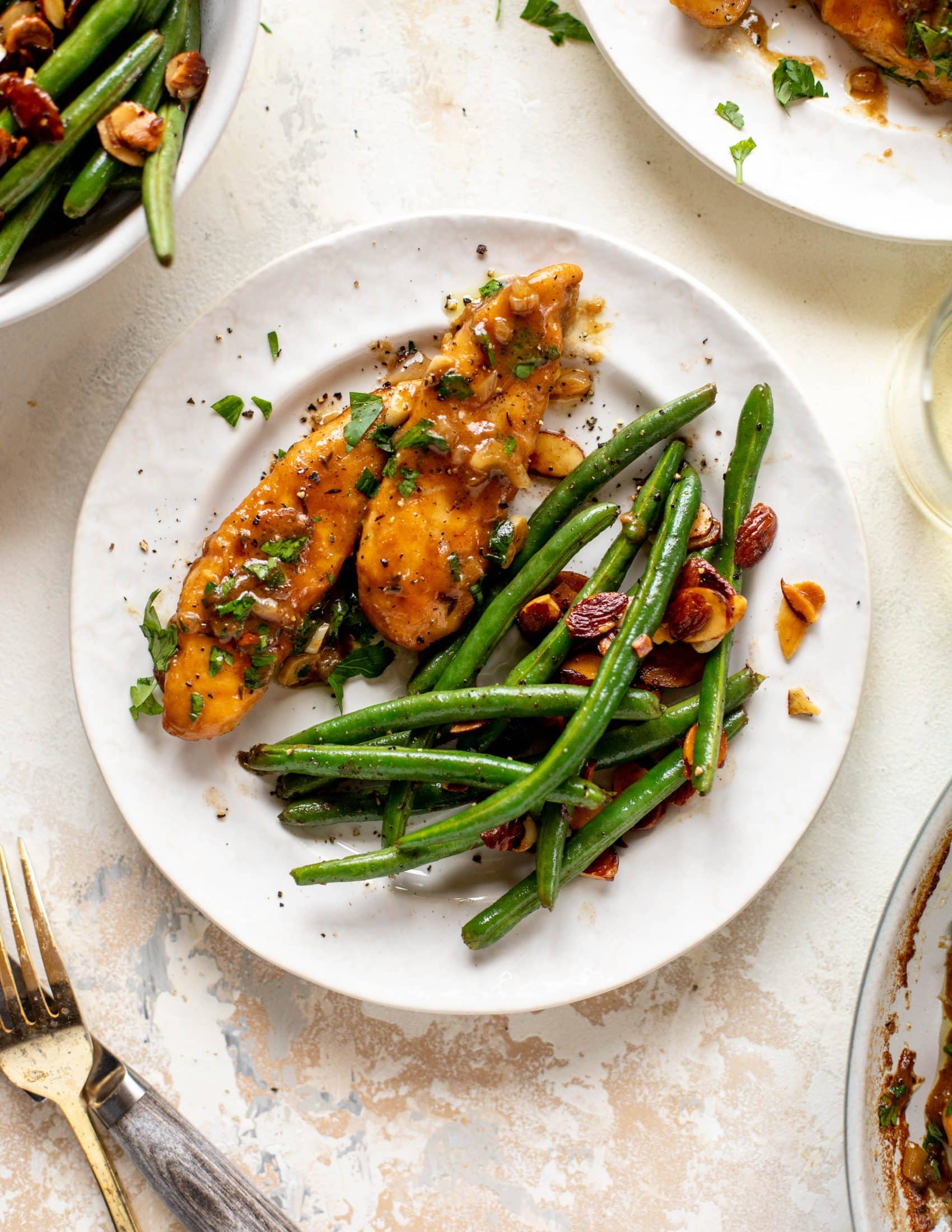 My mom's chicken marsala is easy and ridiculously flavorful! It's made without mushrooms and served alongside almond brown butter green beans.