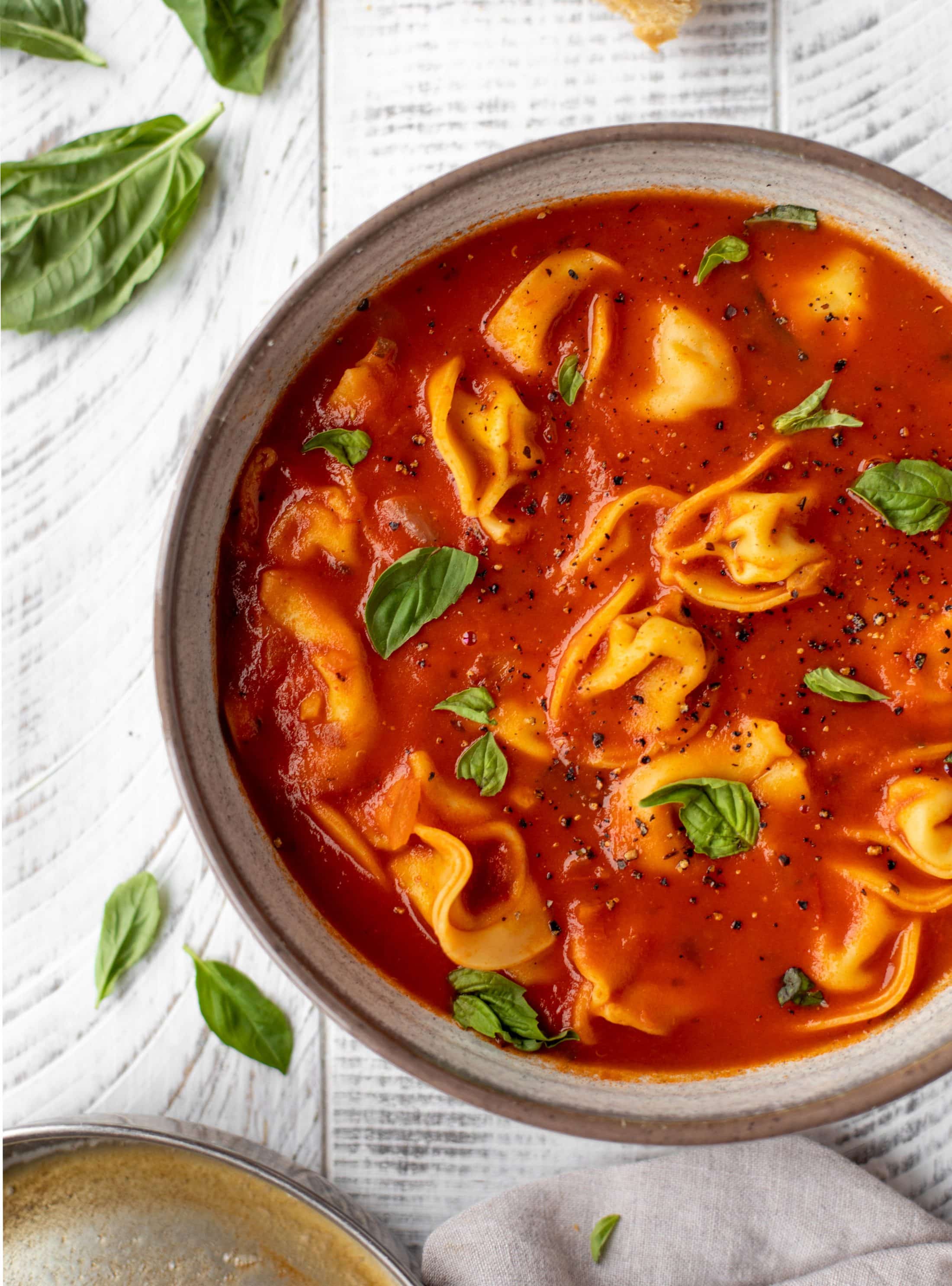 This curried tomato tortellini soup has so much flavor! Serve with cheesy tortellini and brown butter garlic toasts for the perfect weeknight meal.