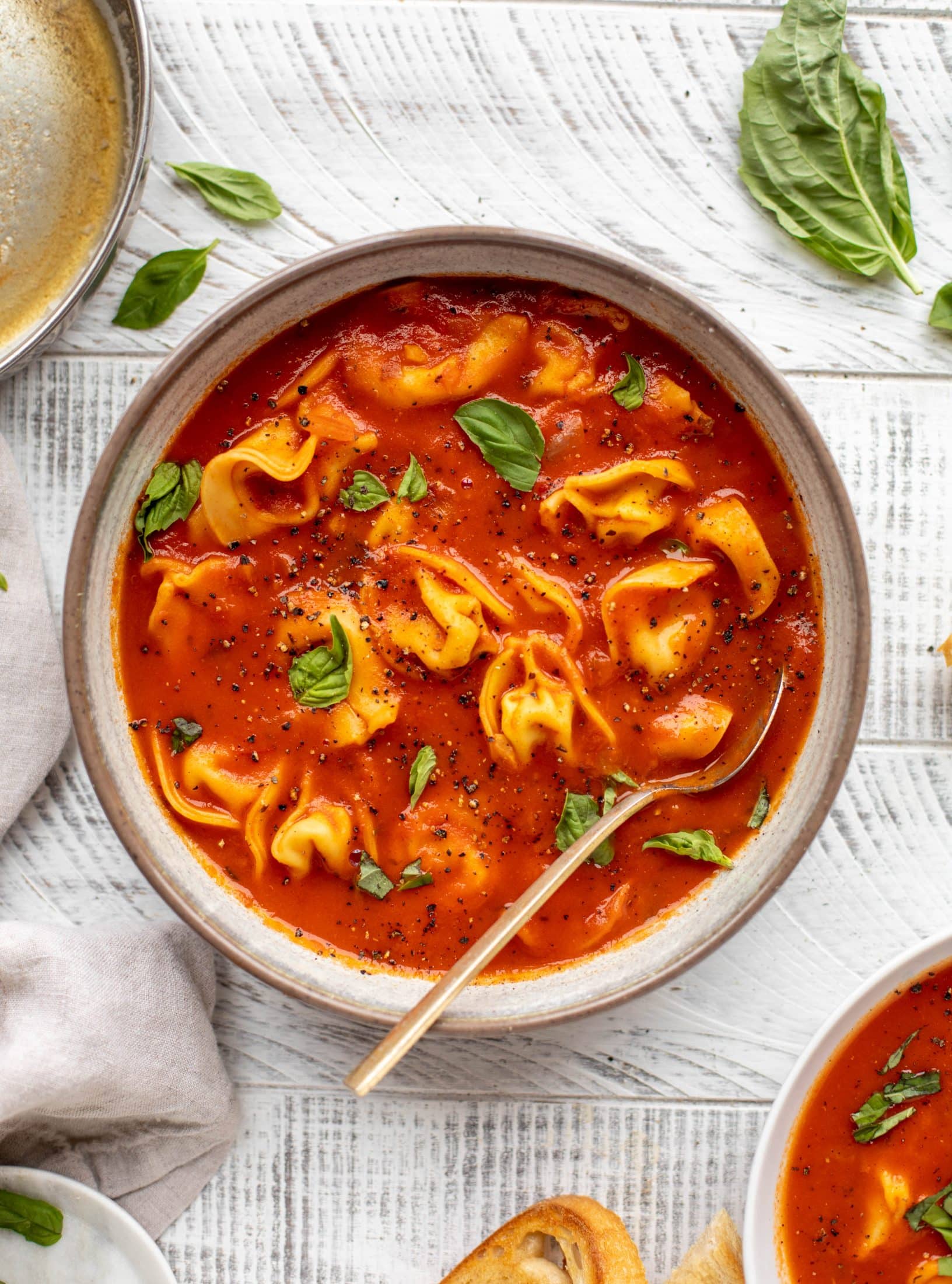 This curried tomato tortellini soup has so much flavor! Serve with cheesy tortellini and brown butter garlic toasts for the perfect weeknight meal.