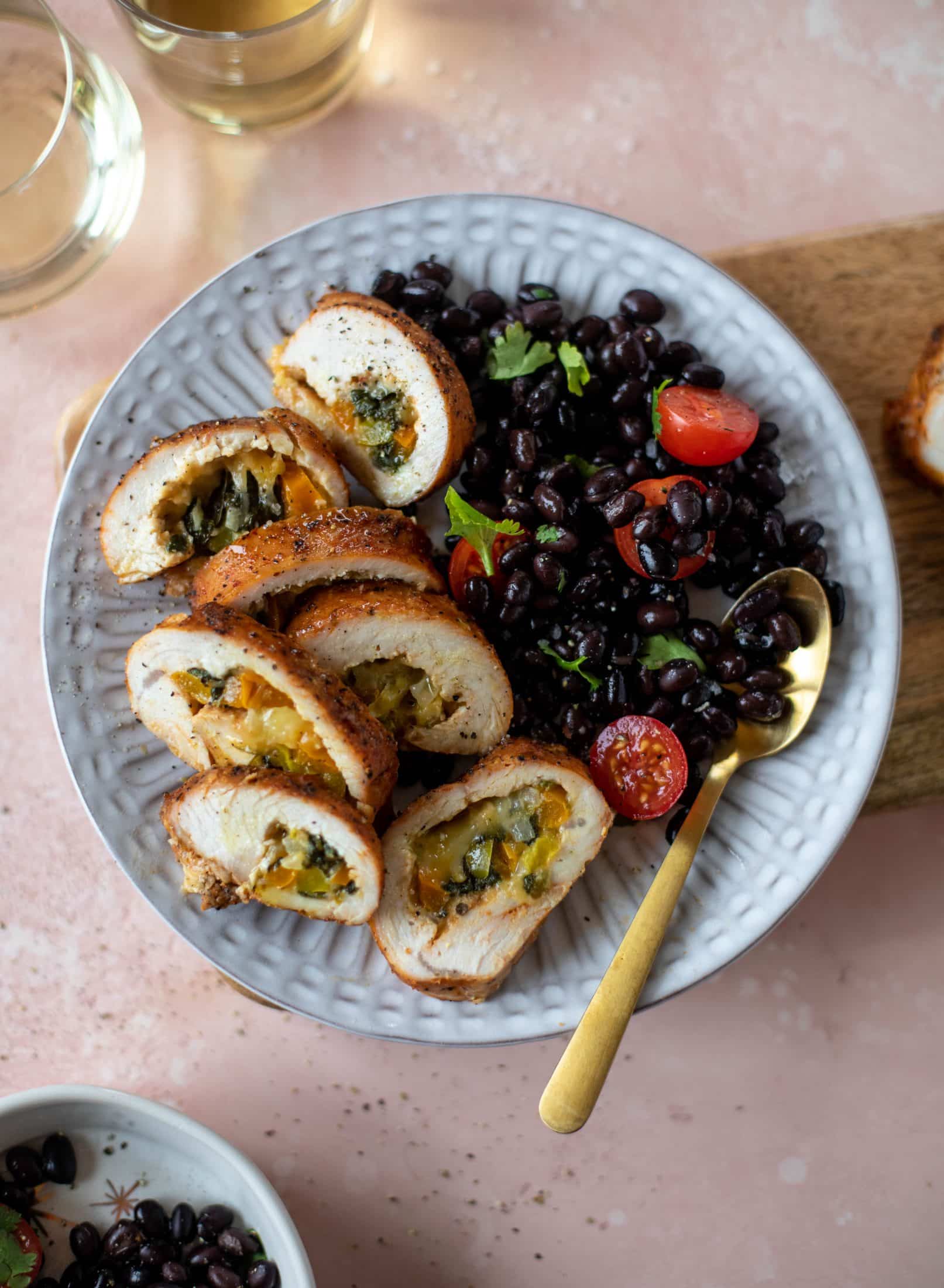 These southwest stuffed turkey tenderloins are so flavorful and filled with spinach, peppers, onions and cheddar! Serve alongside a lime black bean salad.